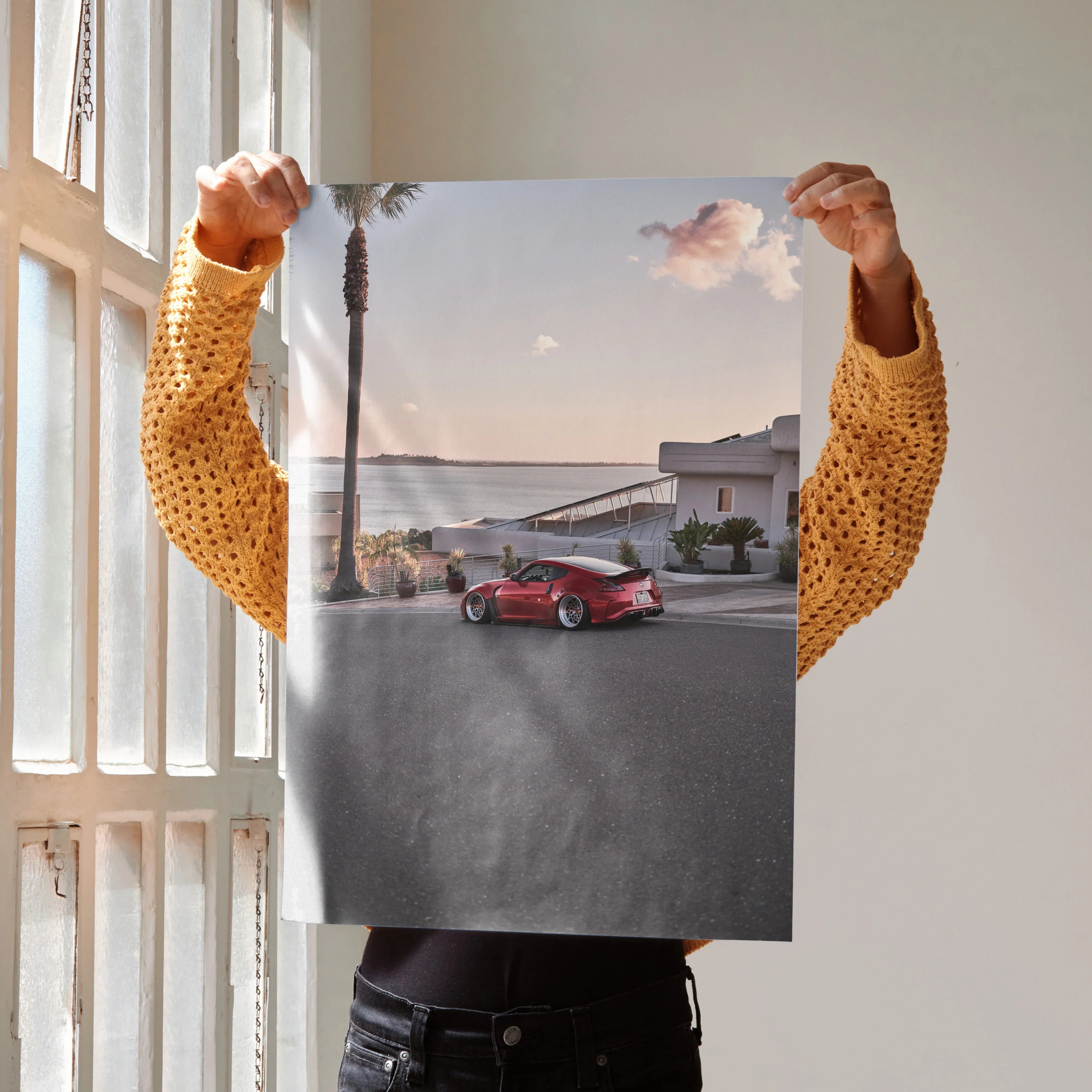 Nissan 370z red sports car poster wall art with coastal road and sunset background.