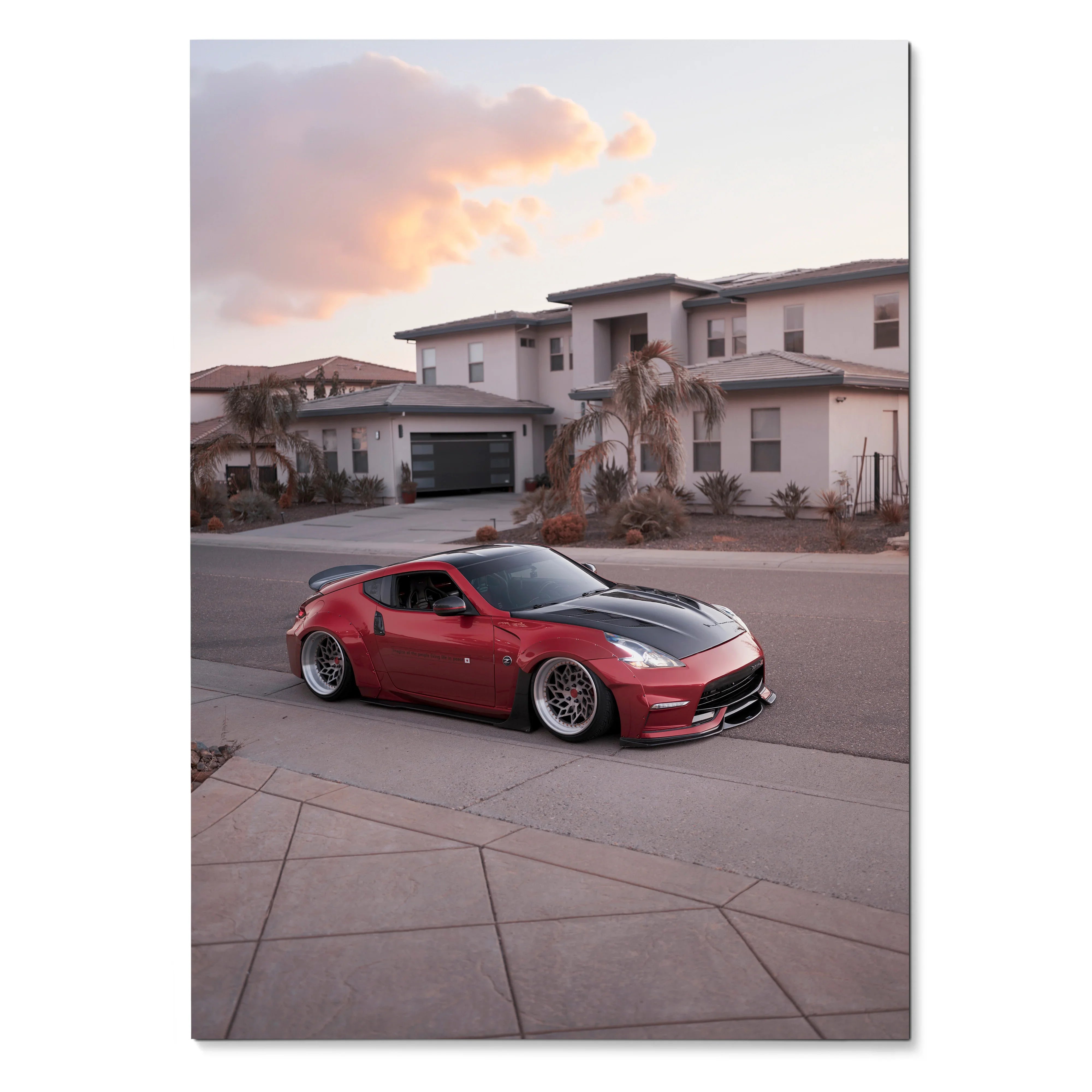 Red Nissan 370z sports car parked on suburban street at sunset, automotive wall art poster.