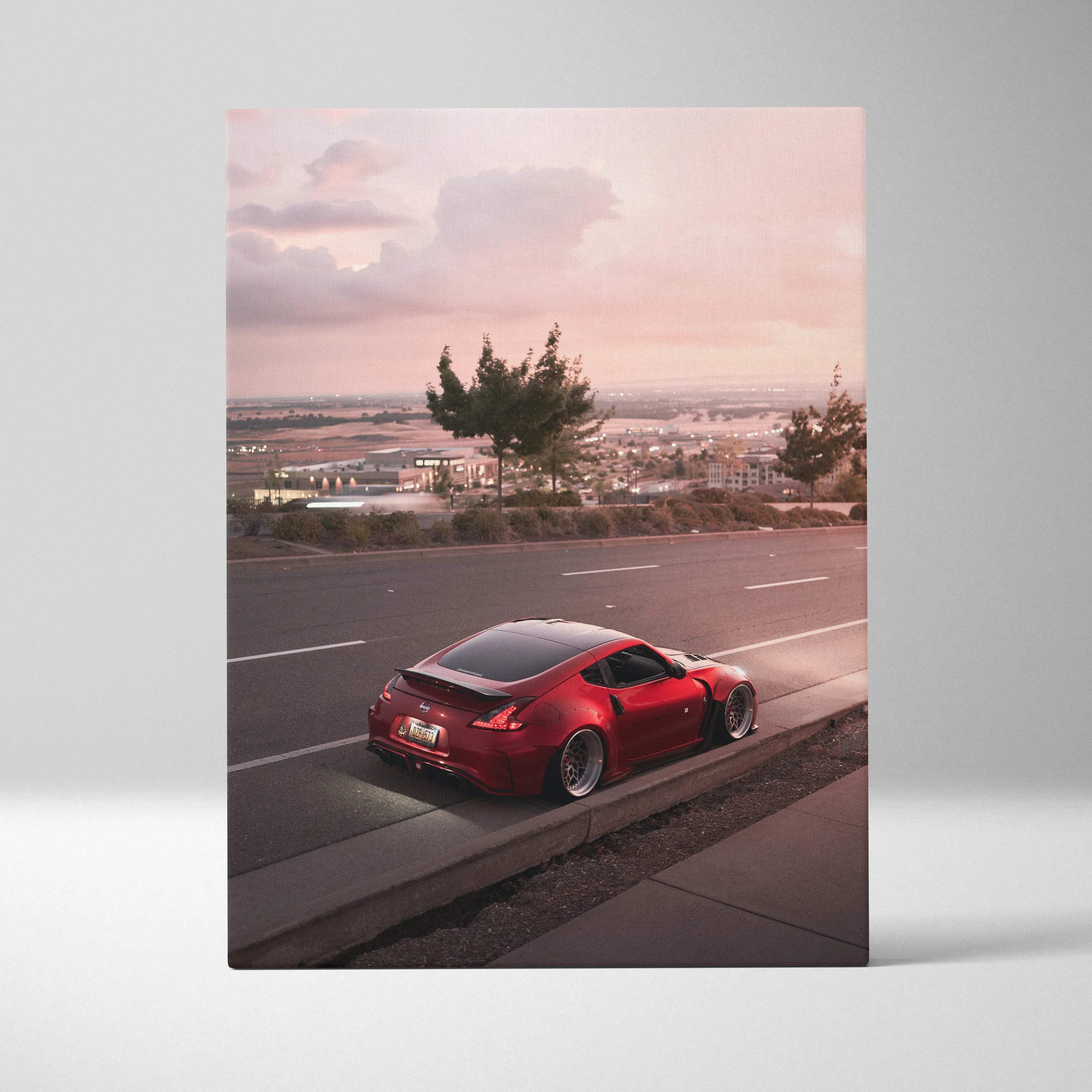 Glossy red nissan 370z sports car with black roof and custom wheels on vertical canvas wall art at sunset pink mood