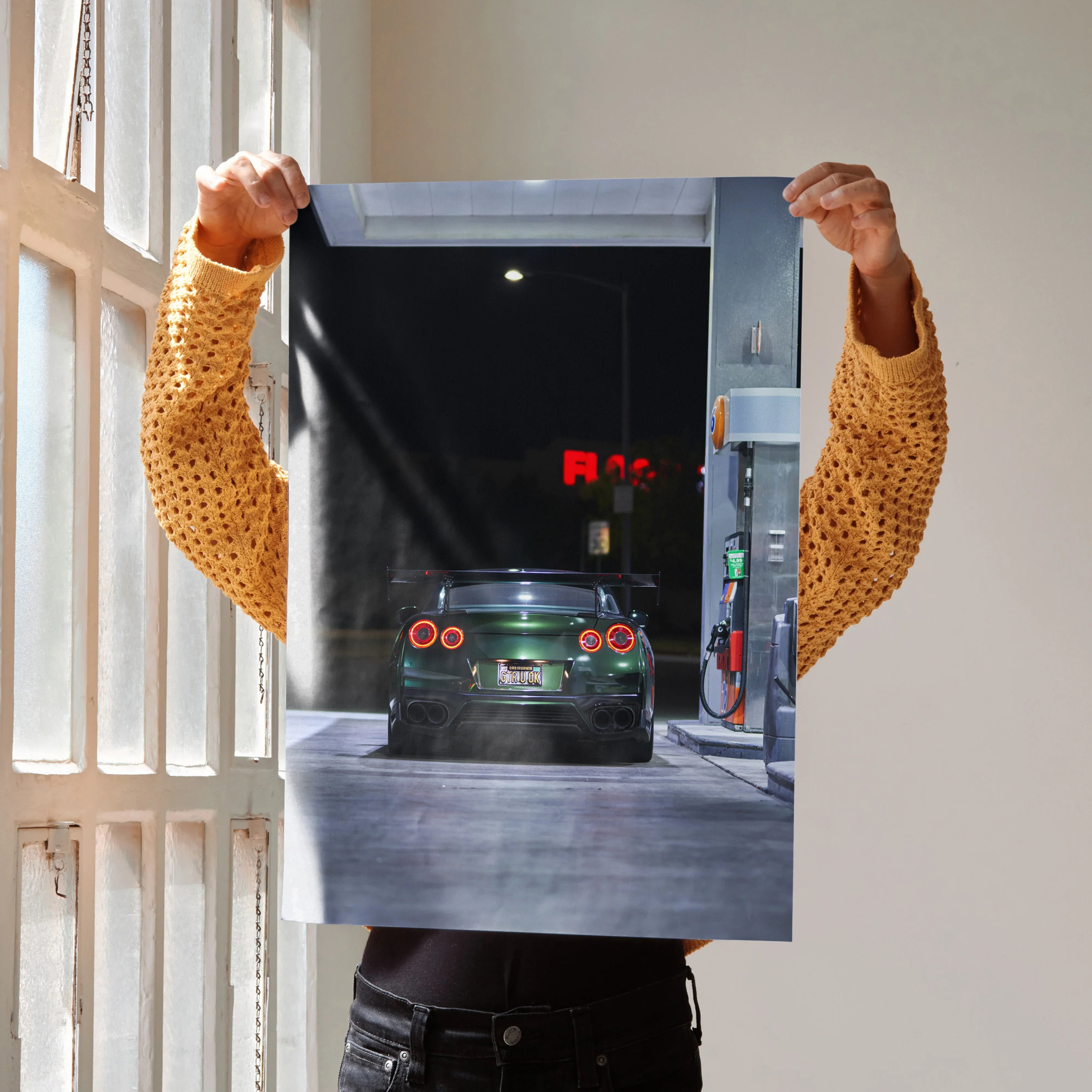 Nissan GTR R35 dark green car at gas station nighttime poster wall art.