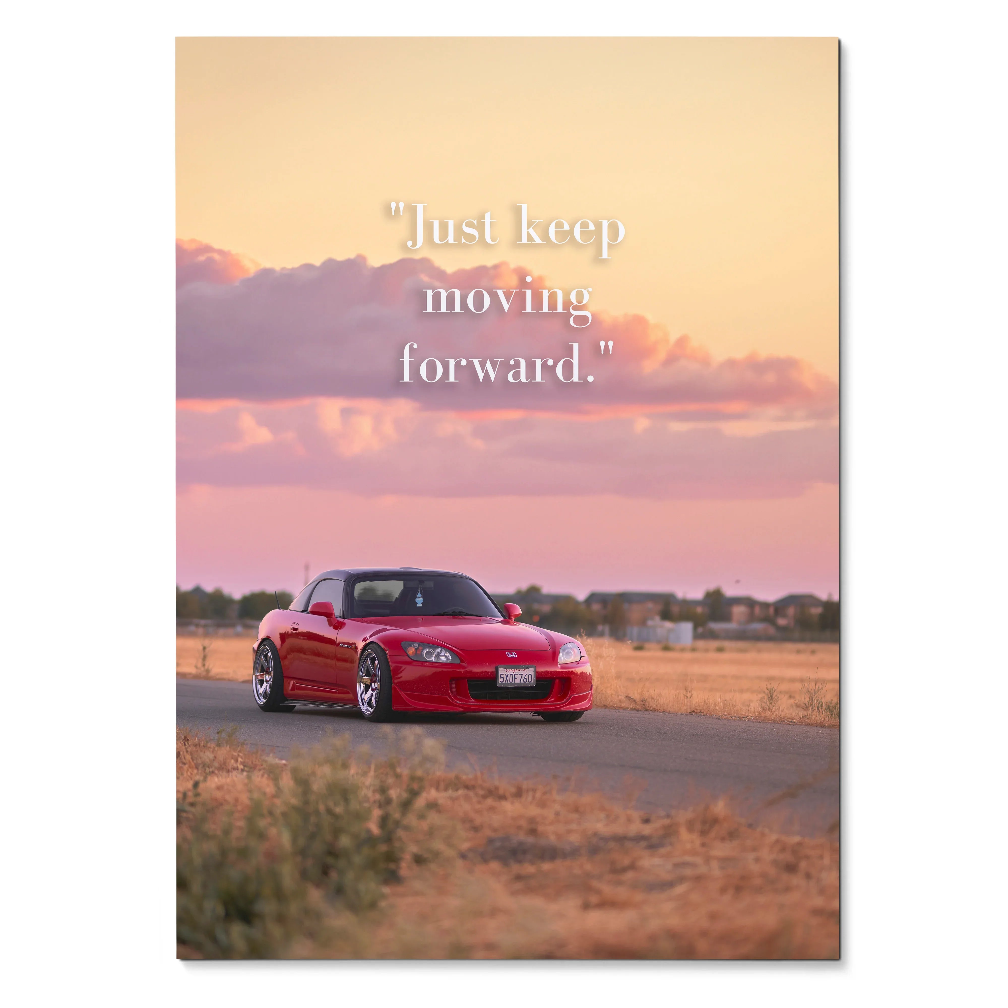 Motivational poster wall art featuring red Honda S2000 on road with sunset and inspiring text.