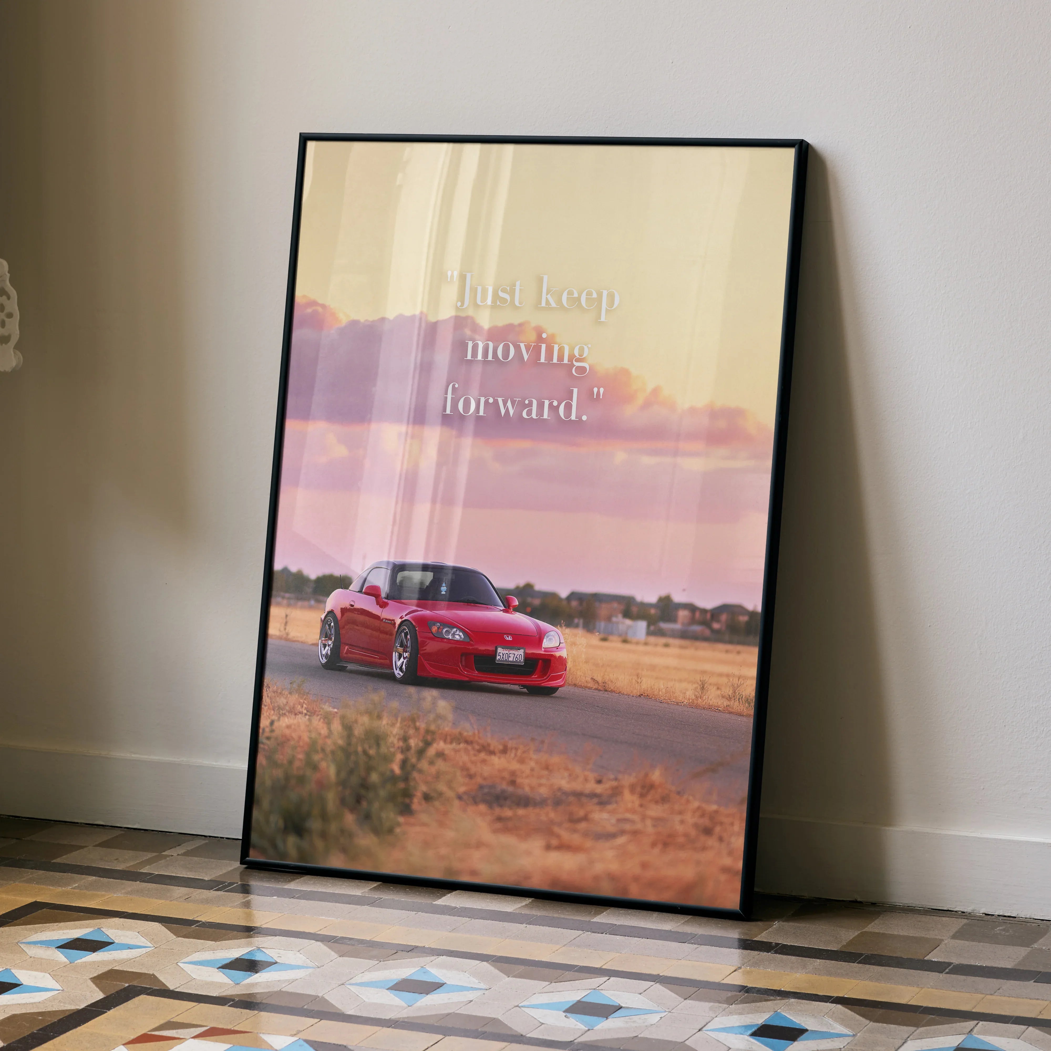 Motivational poster wall art featuring red Honda S2000 with sunset and inspiring text on beige sky background.