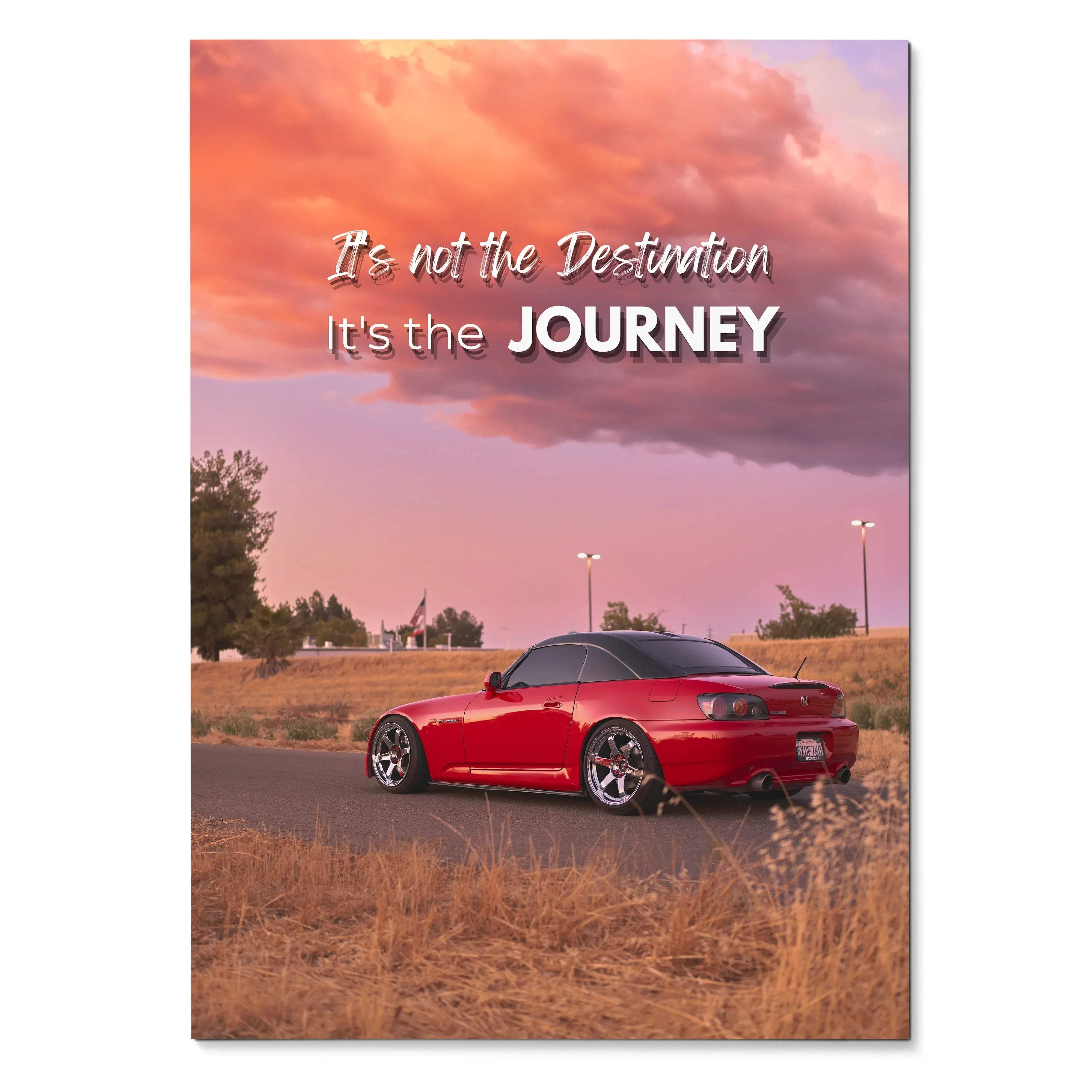 Motivational poster featuring a vibrant red honda s2000 sports car with black roof under a dramatic pink sky