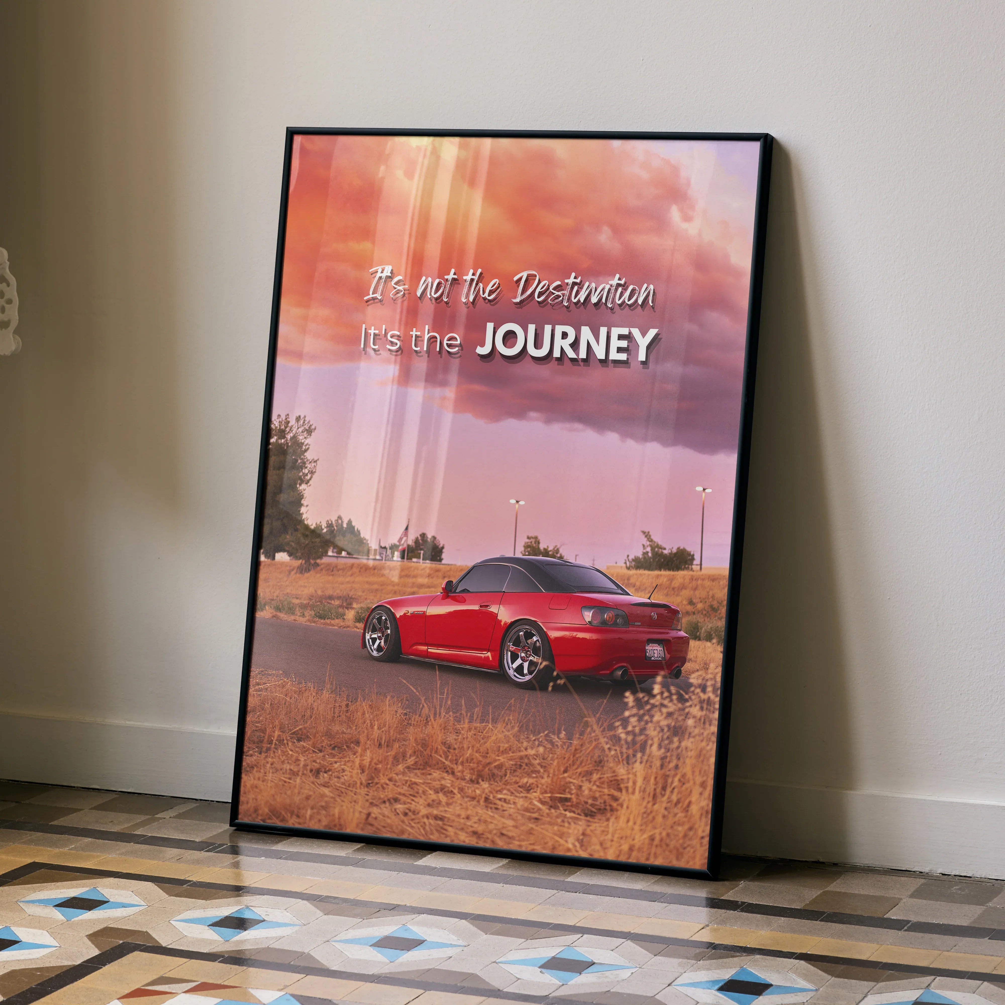 Motivational poster wall art featuring red Honda S2000 with inspiring text against sunset sky.