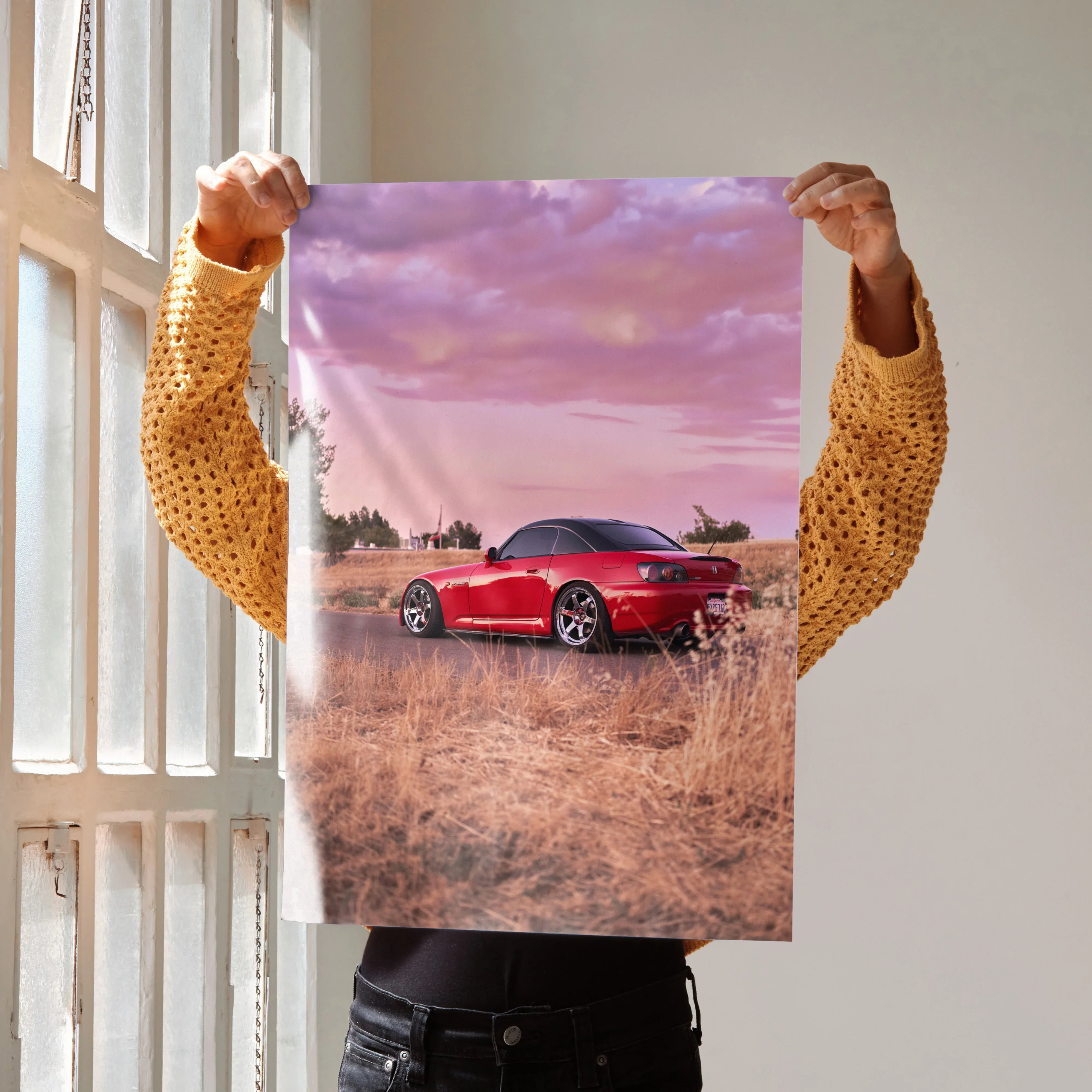 Honda S2000 red sports car poster with sunset sky wall art in a dry field.