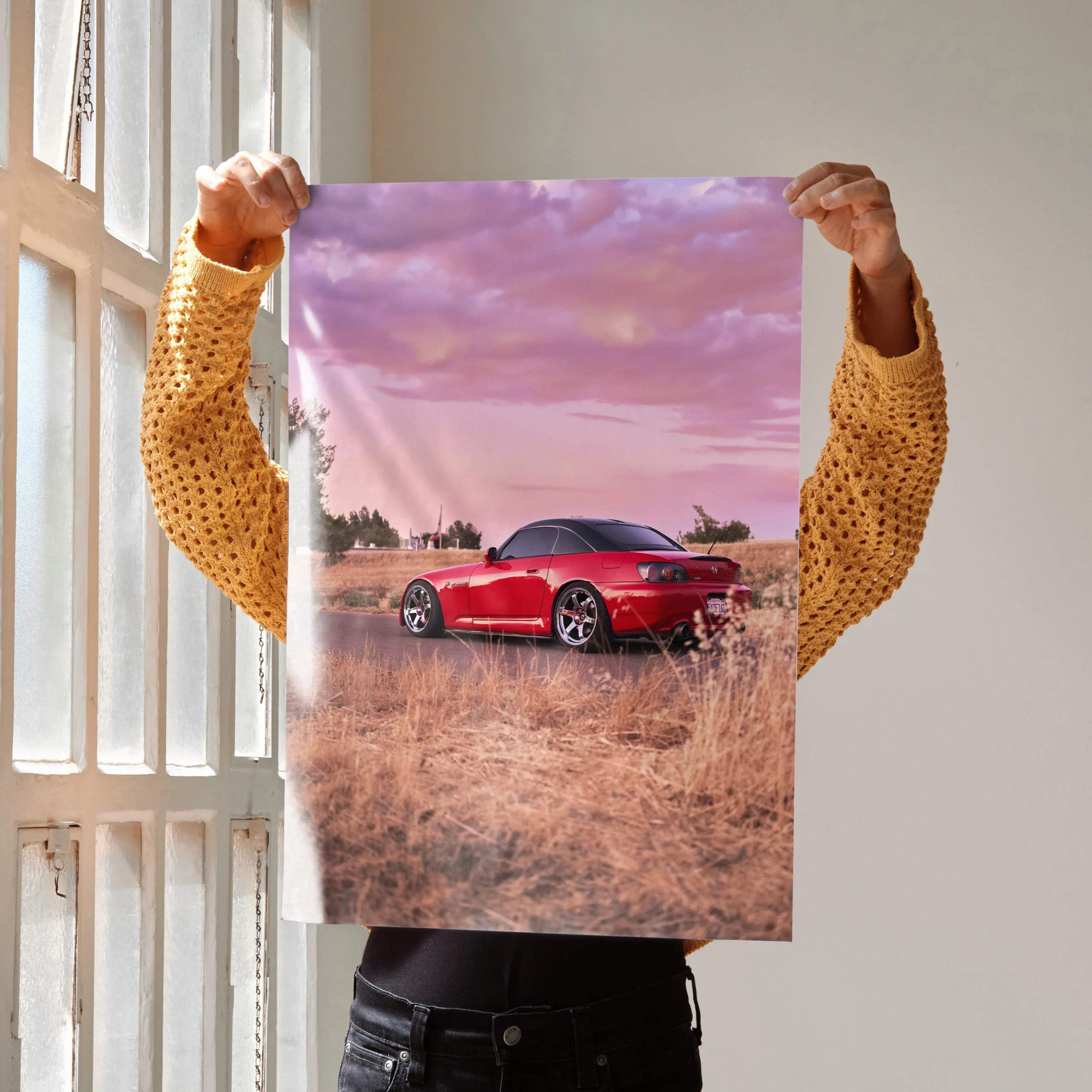 Red honda s2000 sports car poster with sleek glossy finish and detailed design against soft pink sky background