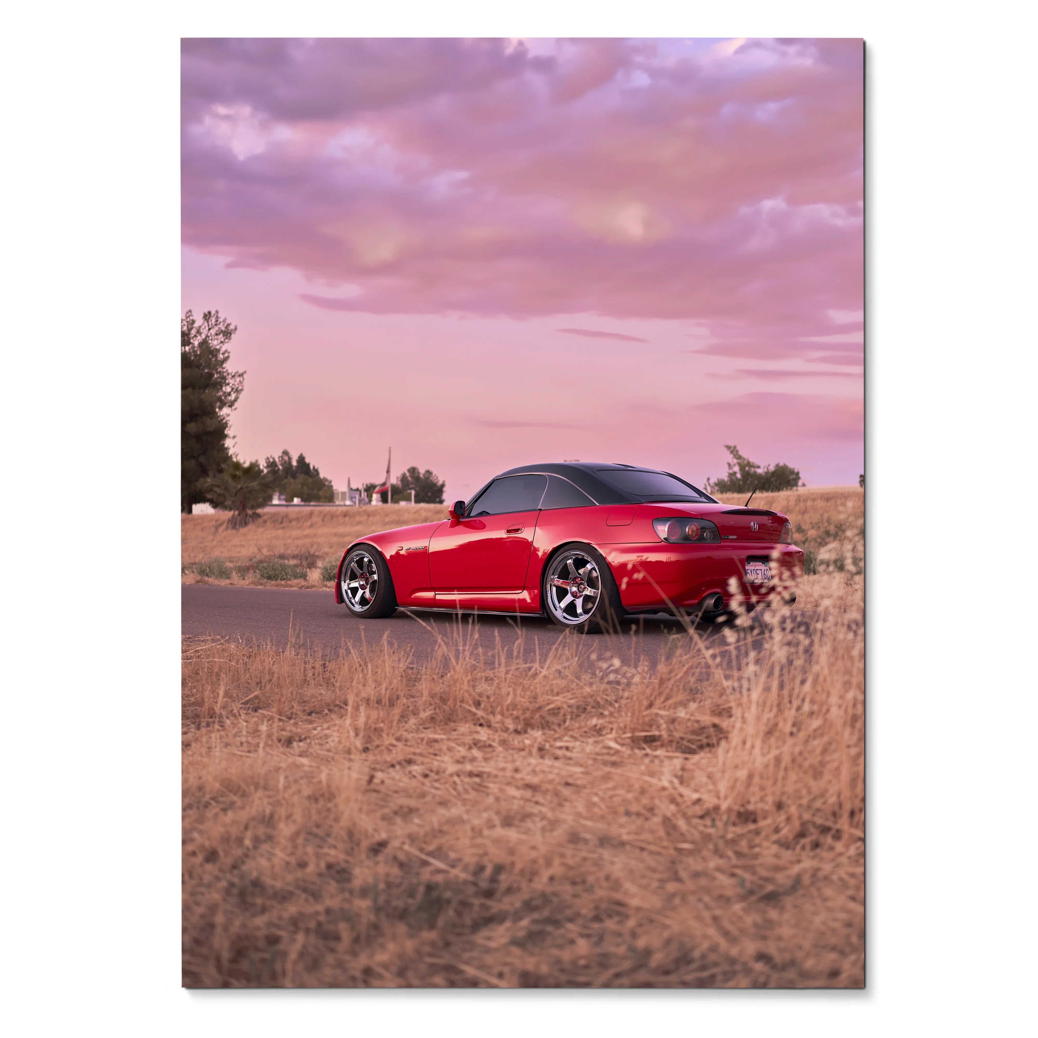 Red Honda S2000 sports car parked on a rural road at sunset poster wall art.