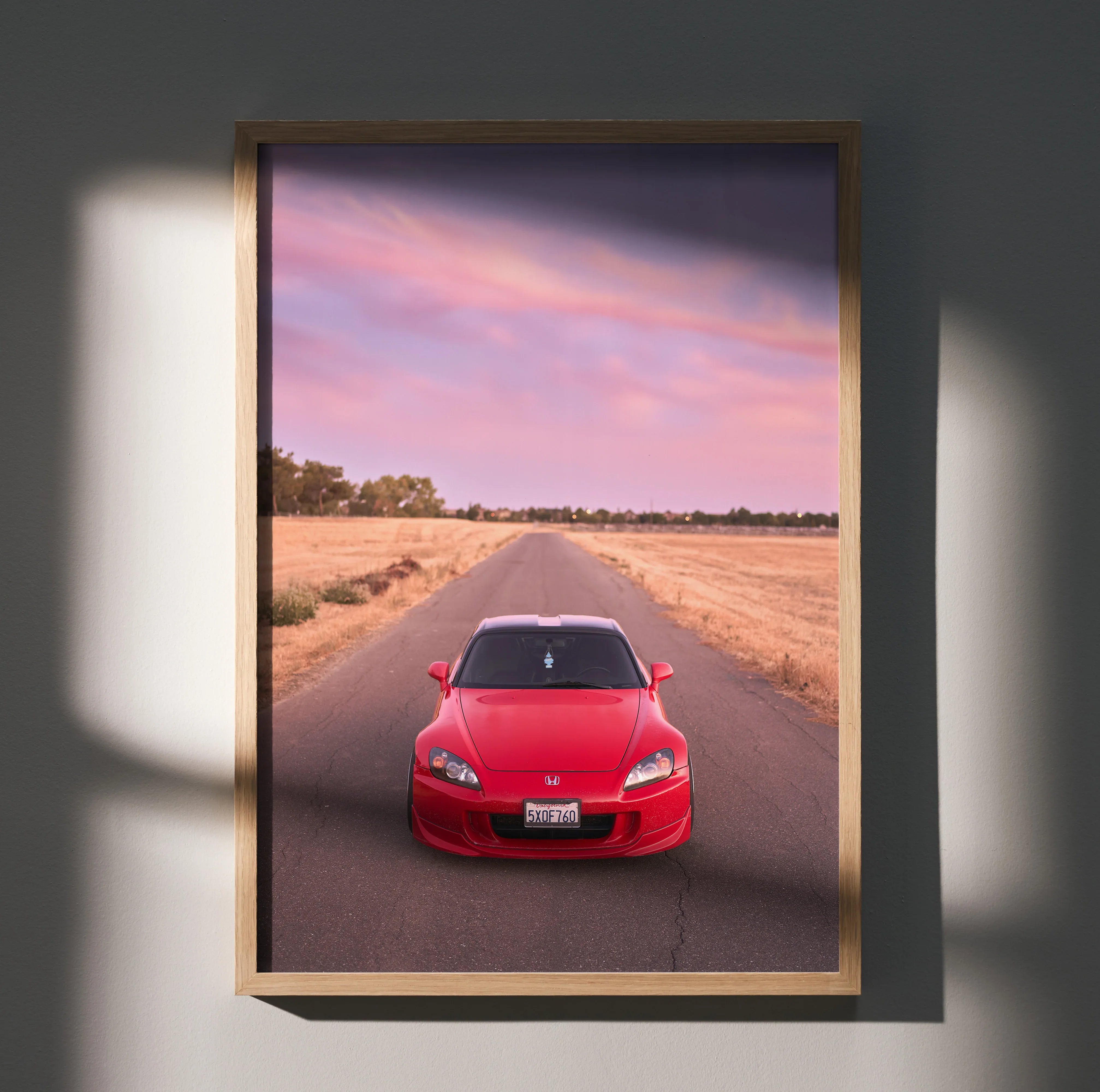 Honda S2000 red sports car poster with sunset sky and open road, wall art in wooden frame.