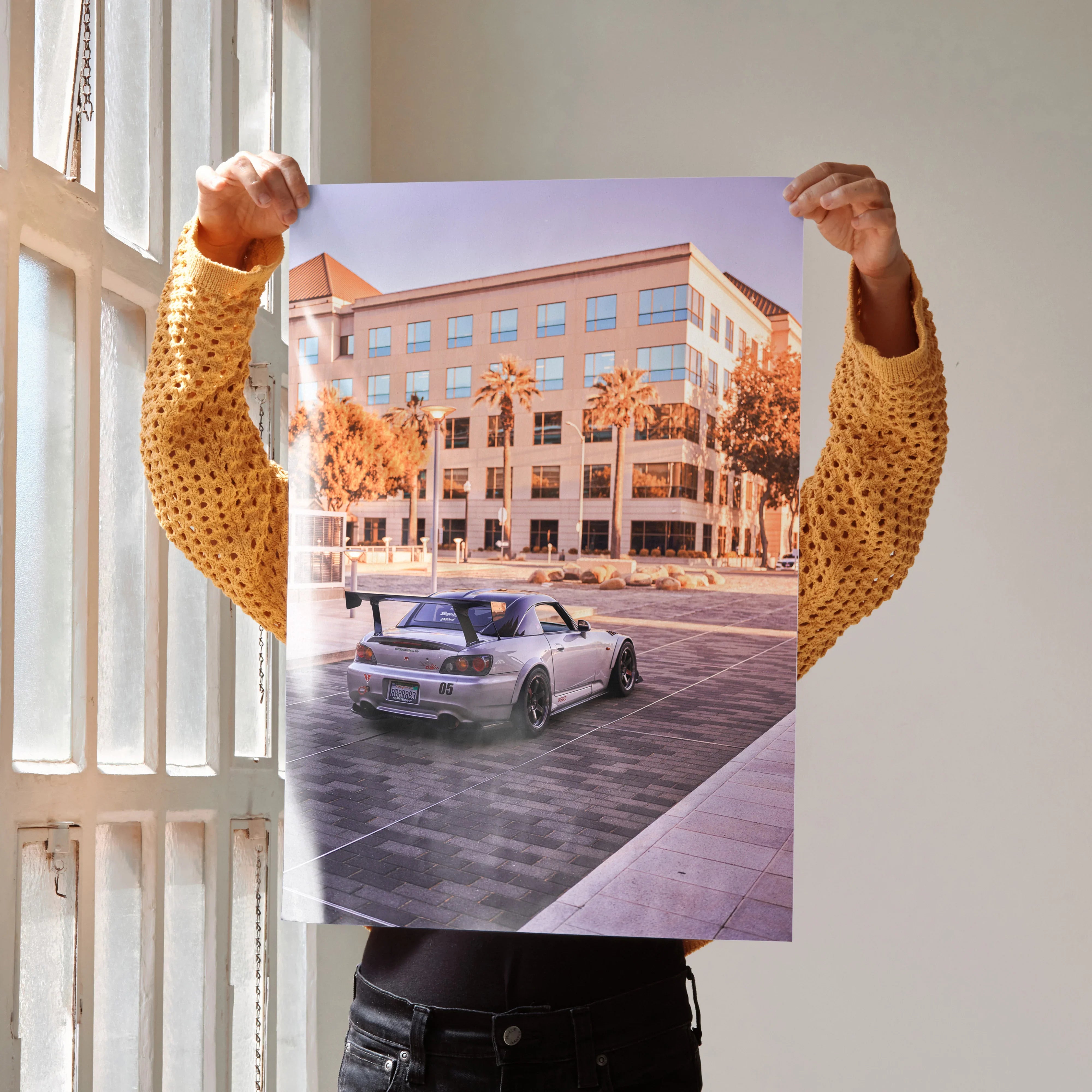 Honda S2000 poster featuring a silver sports car on urban street with palm trees wall art.