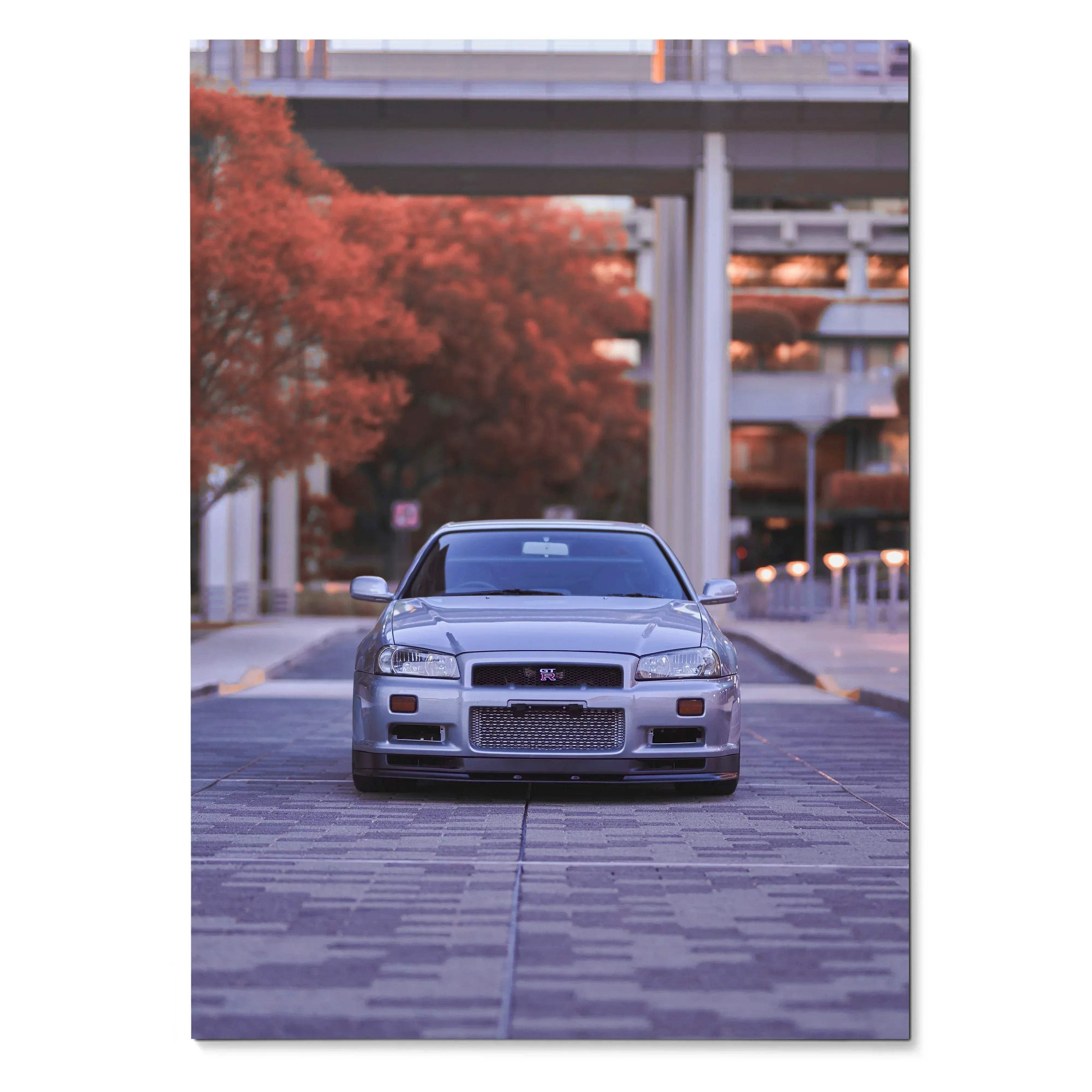 Nissan R34 GTR parked under urban bridge with autumn trees poster wall art.