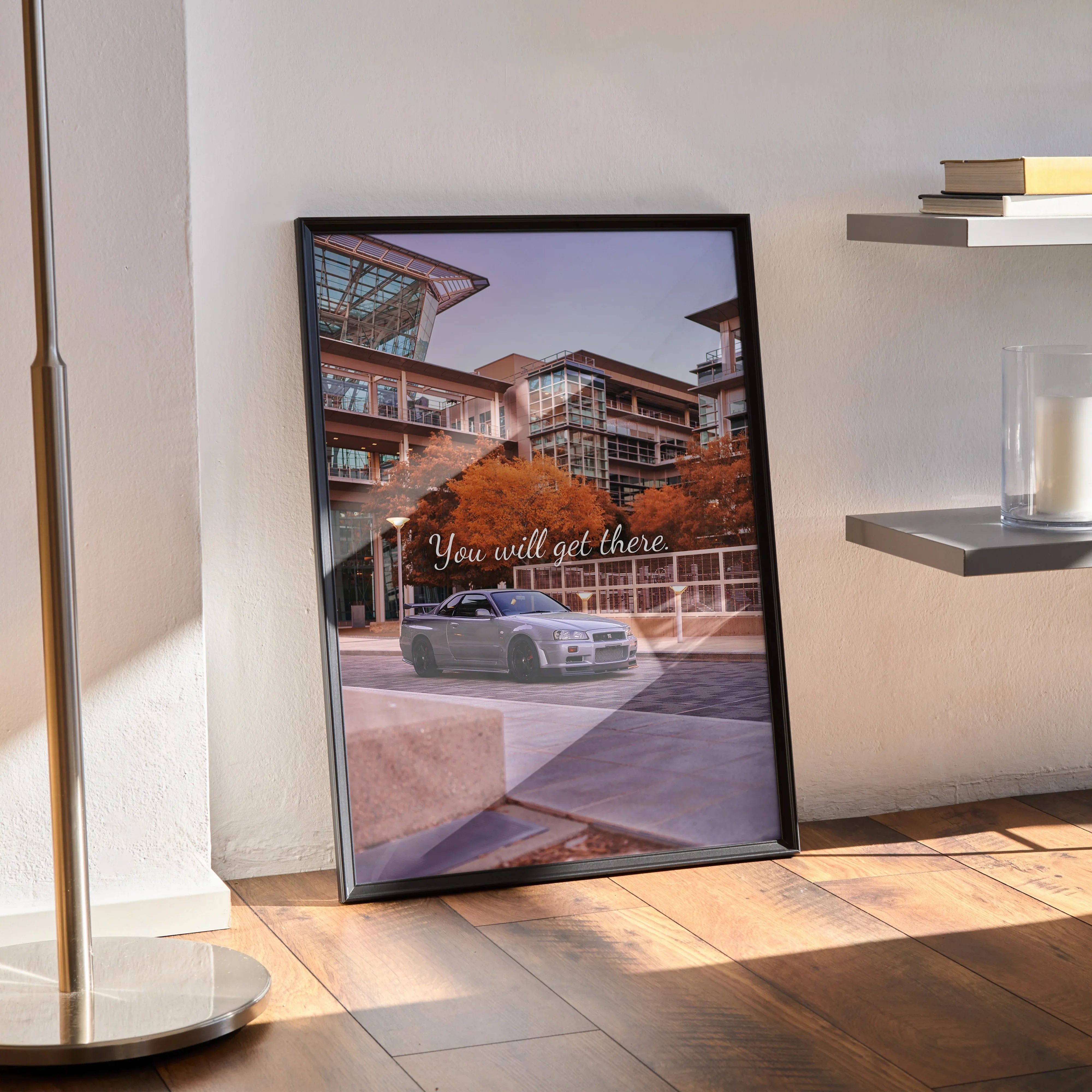 Framed Nissan GT-R R34 Skyline poster with modern building background and motivational text wall art.