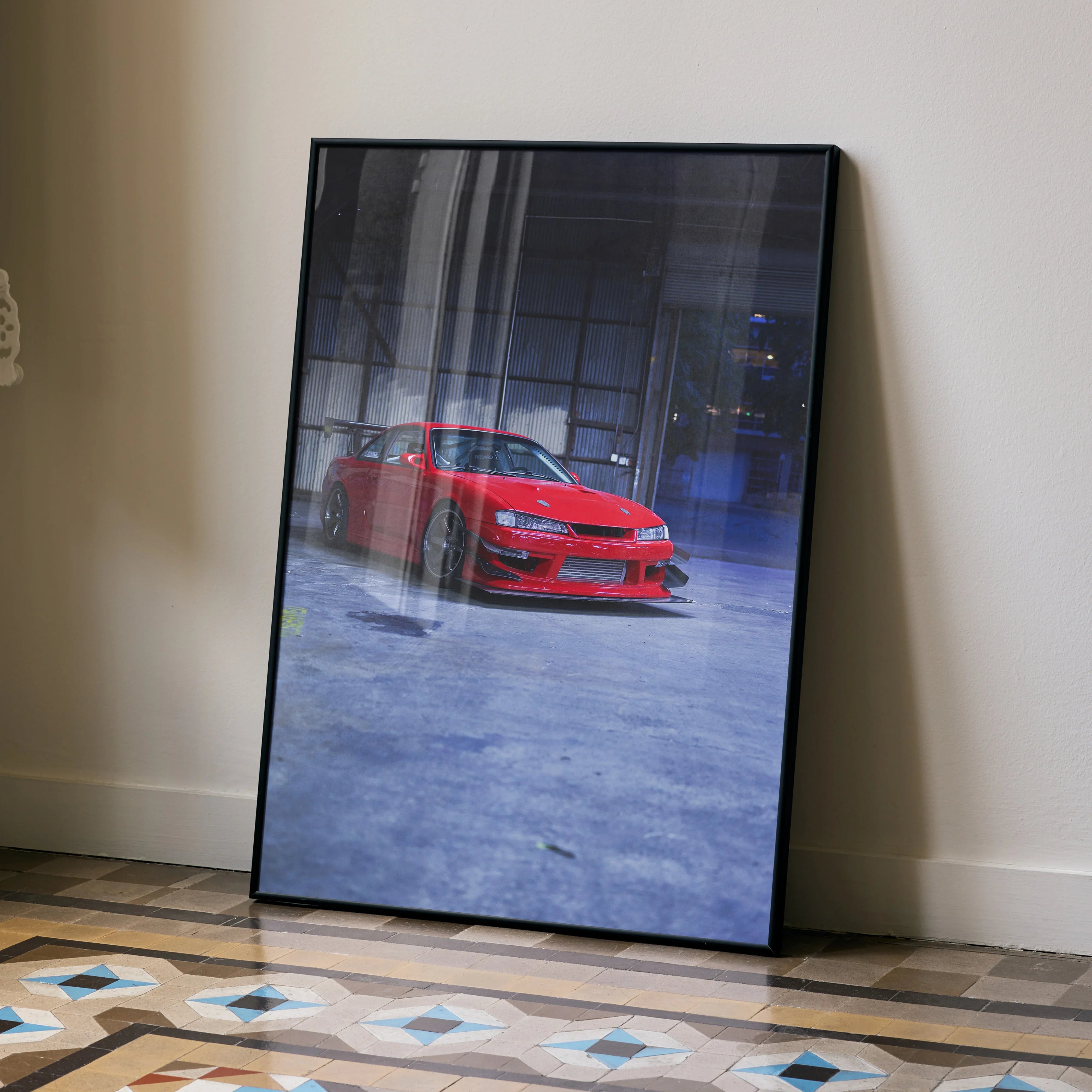 Red Nissan 240sx S14 Kouki poster with blue and gray urban background leaning against wall wall art.