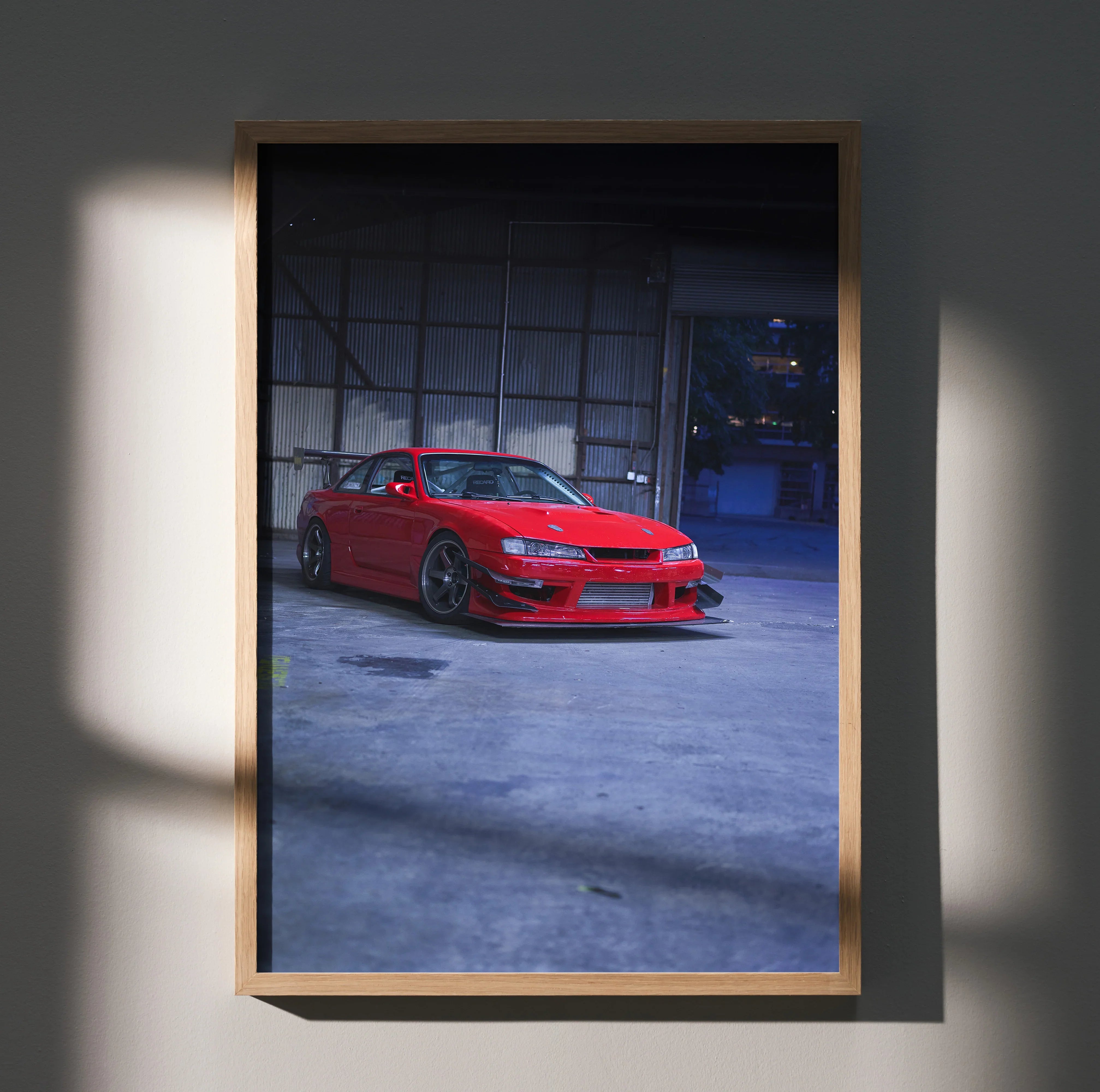 Nissan 240sx S14 Kouki red car poster wall art in wooden frame with industrial background.