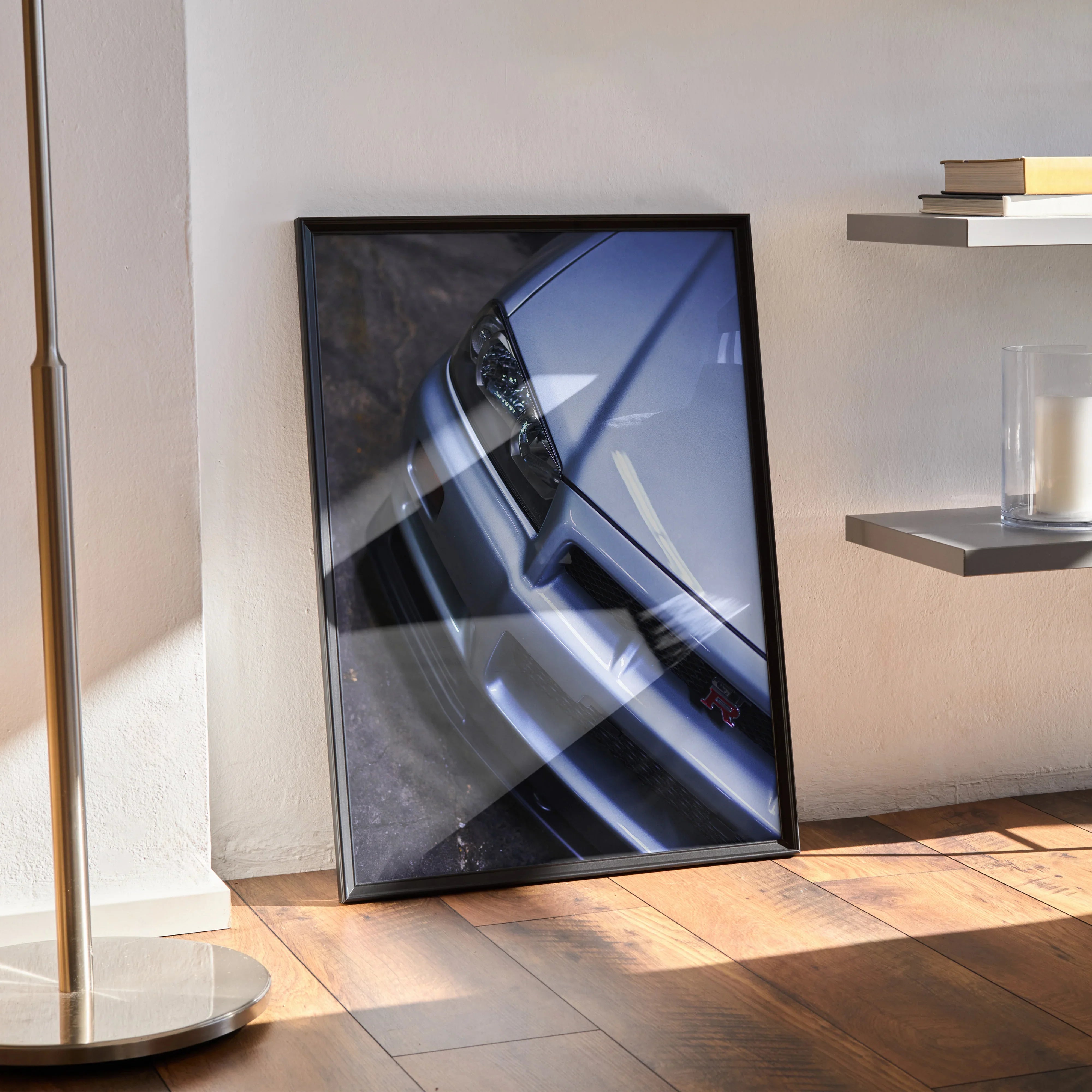 Nissan R34 GTR Skyline close-up poster with sleek silver car front in black frame wall art.