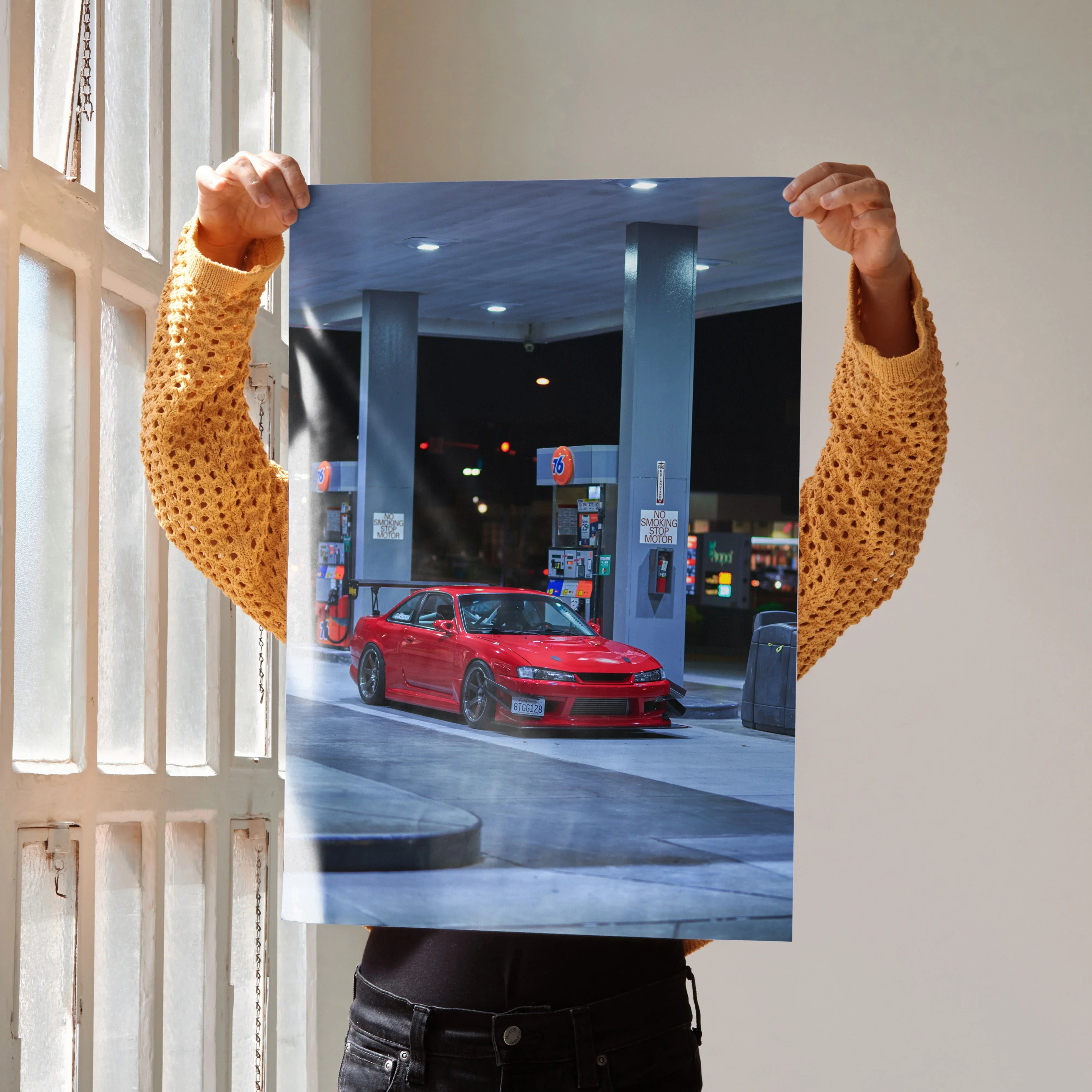 Red Nissan 240SX S14 Kouki at gas station poster wall art with nighttime urban background.