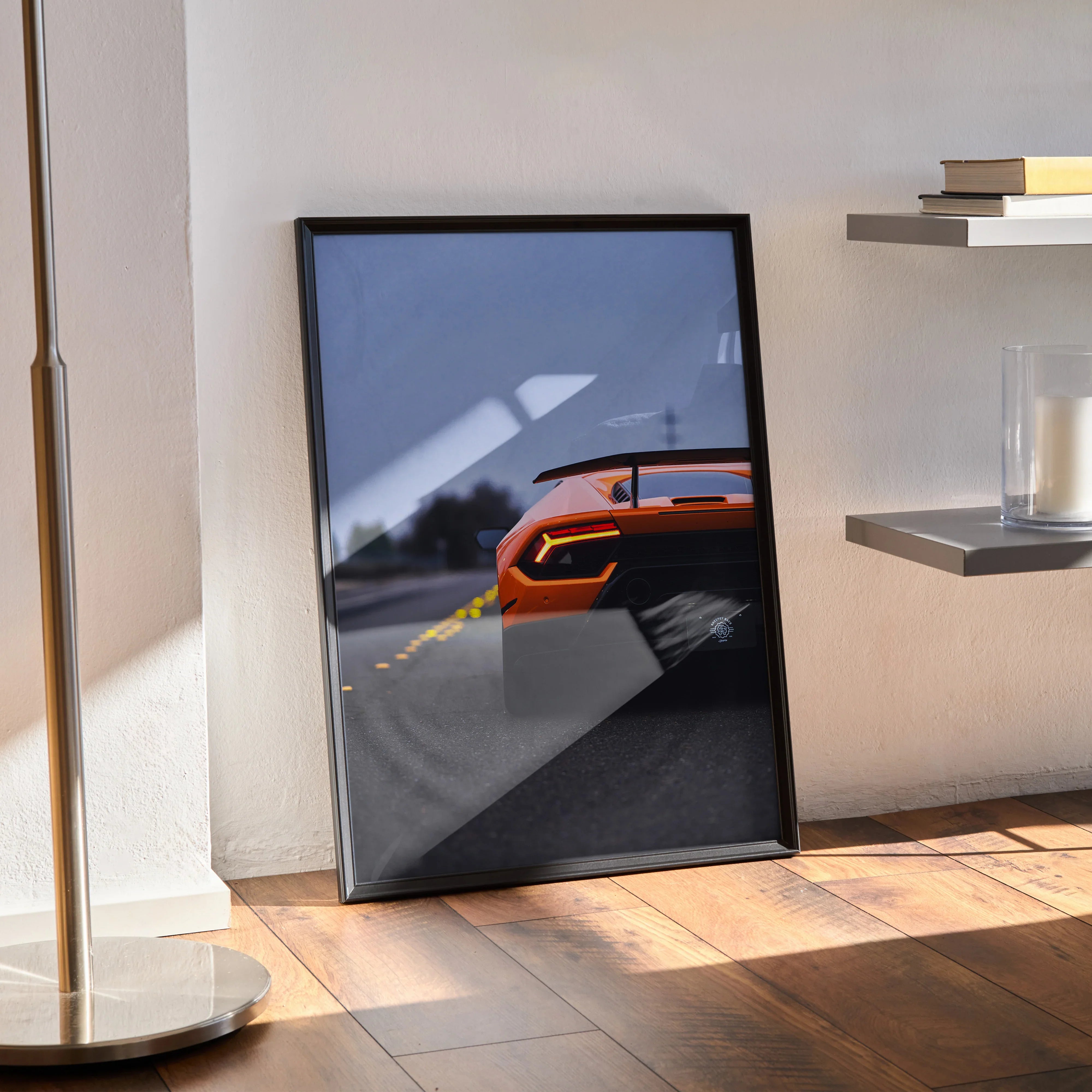 Lamborghini Huracan rear view poster with orange sports car and blurred motion wall art in black frame.