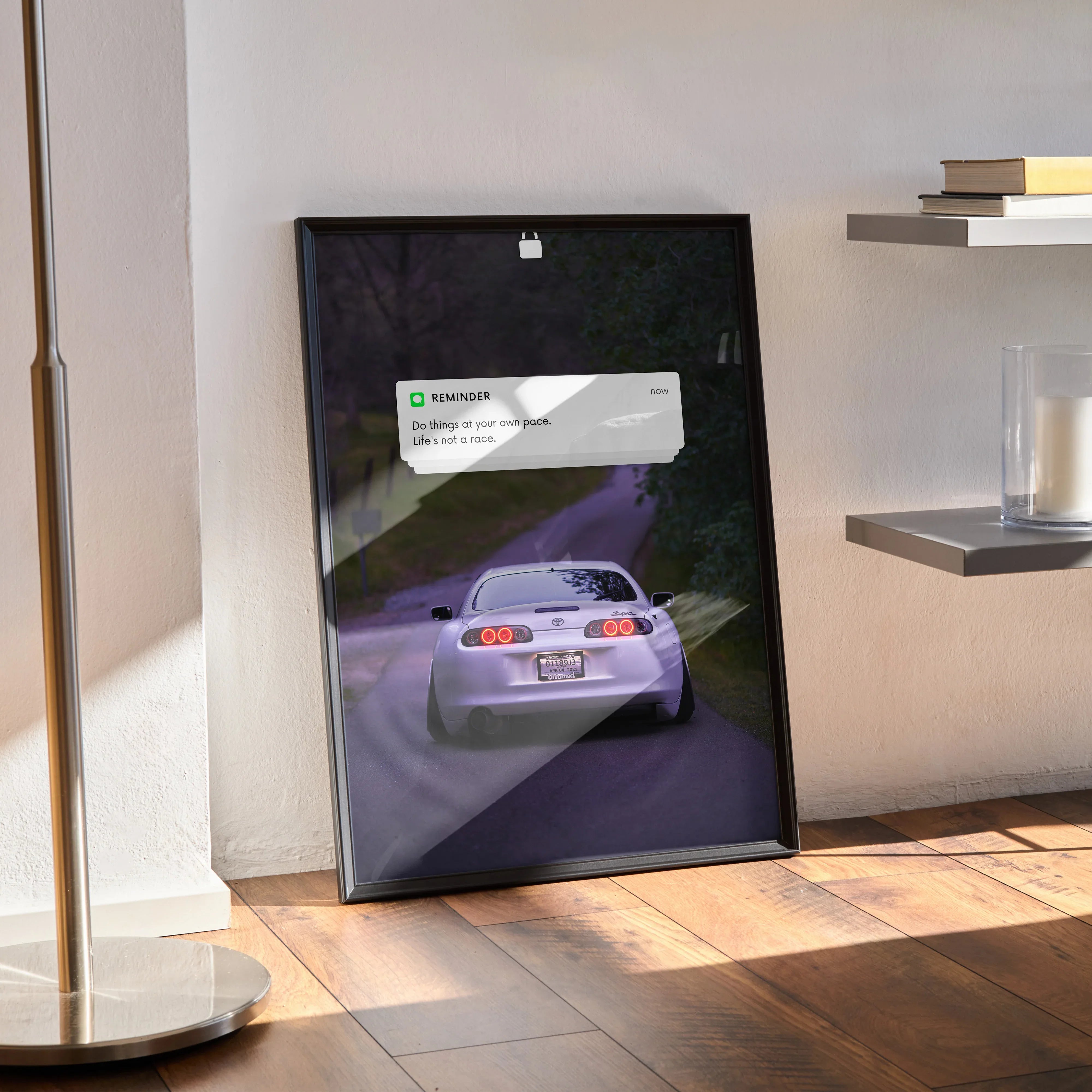 Motivational poster wall art featuring rear view of white Toyota Supra Mk4 on road at dusk.