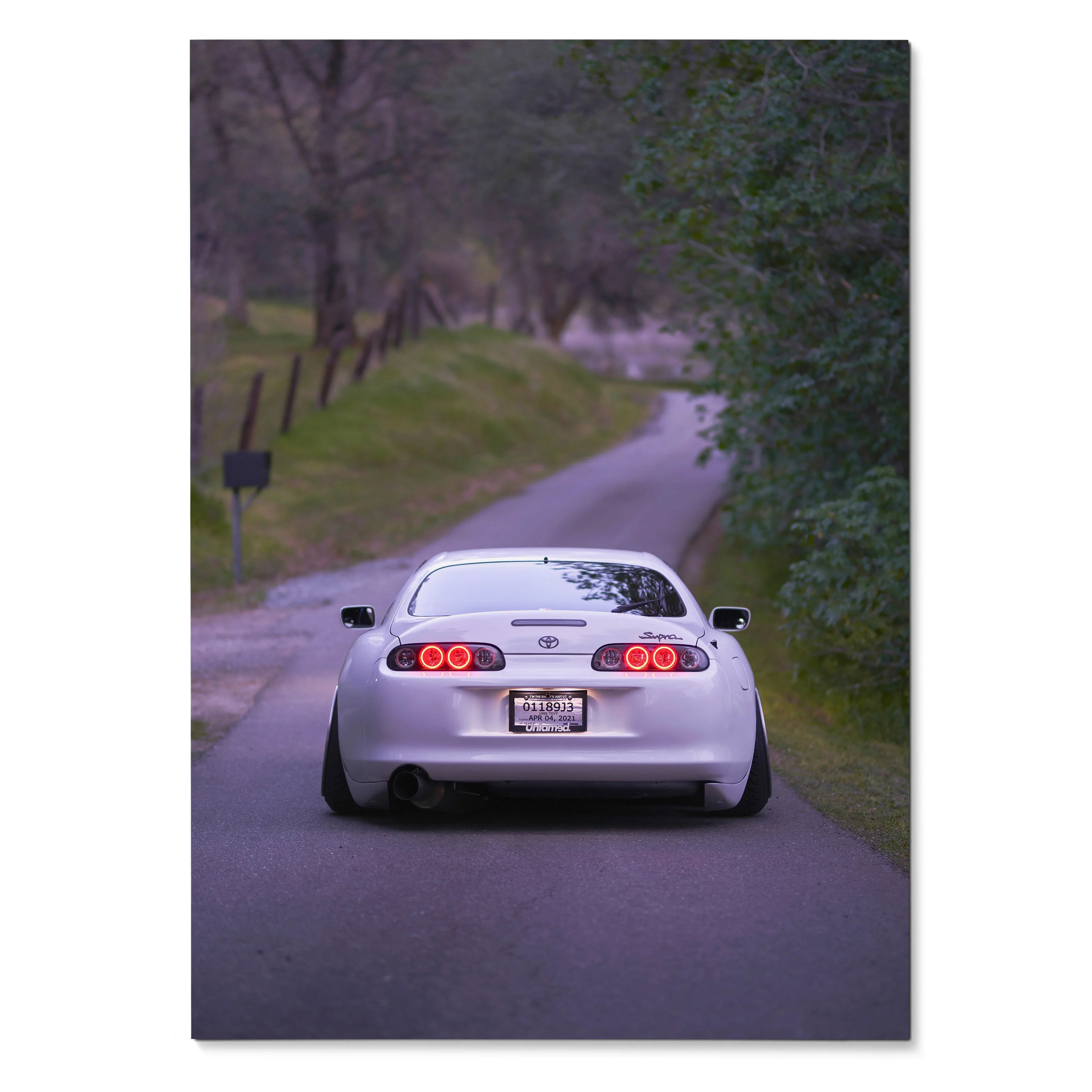 Toyota Supra MK4 rear view poster on rural road, iconic white sports car wall art.
