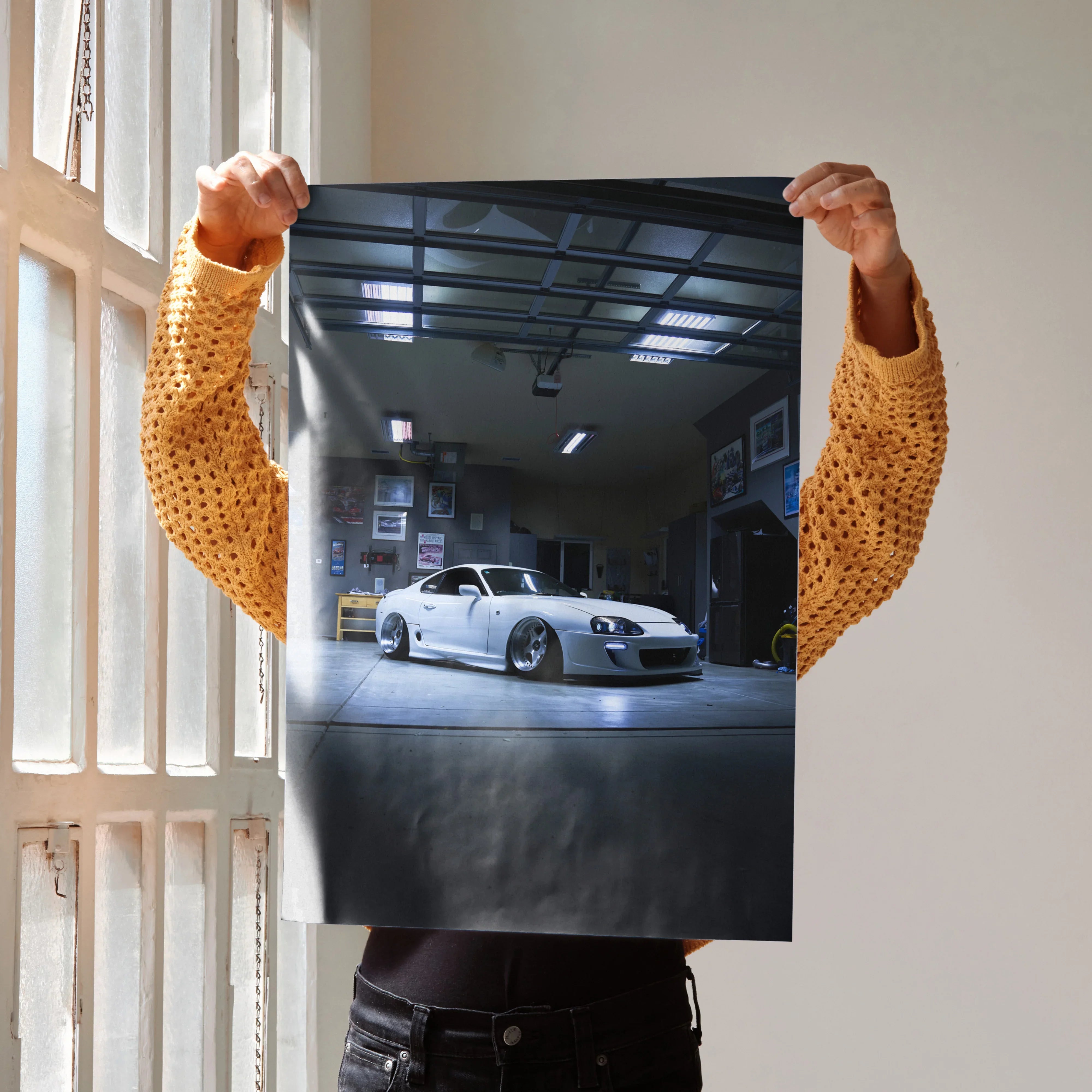 Toyota Supra MK4 car in a garage setting, glossy poster wall art with sleek white sports car and reflective floor.