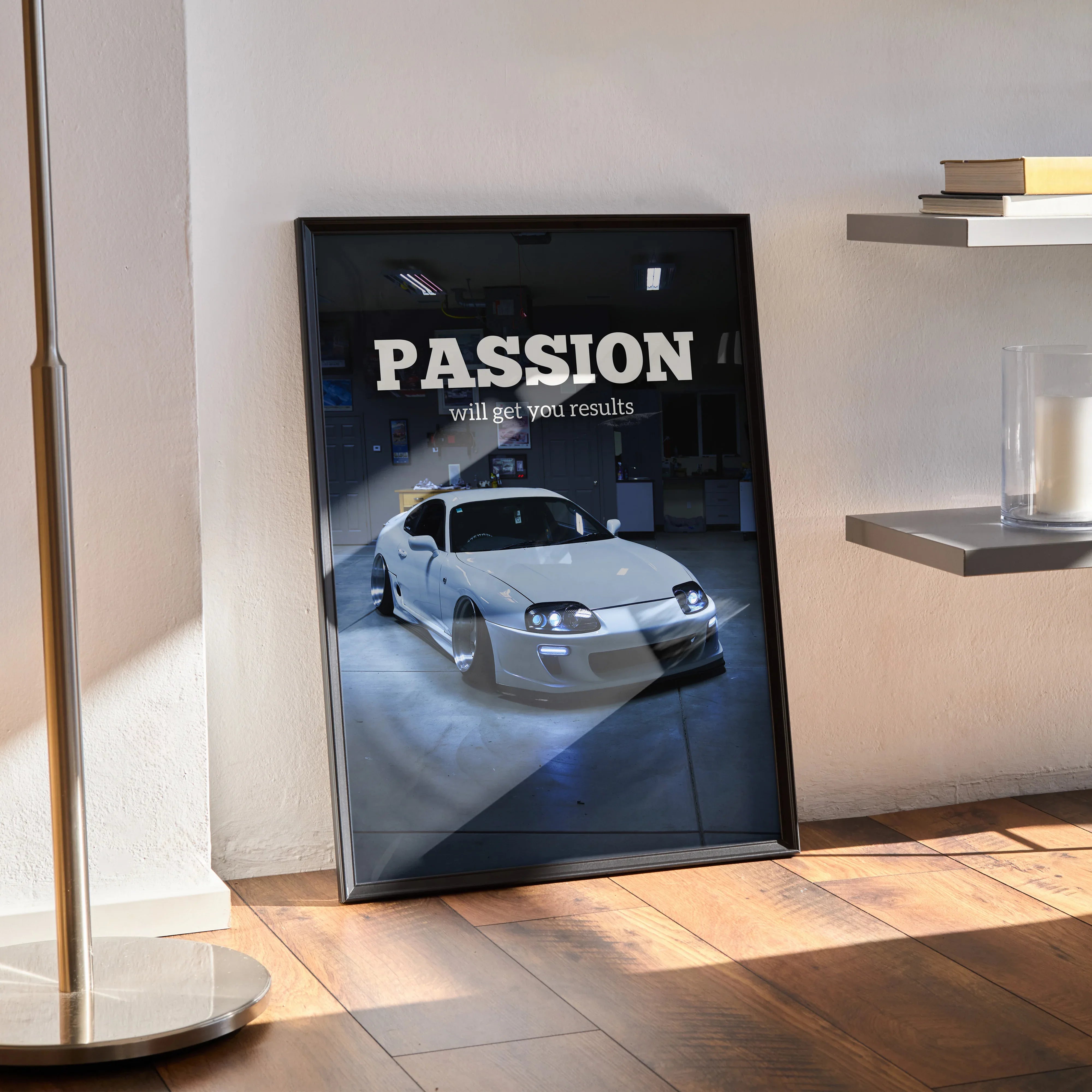 Motivational poster featuring white Toyota Supra Mk4 with inspiring text, black framed wall art.