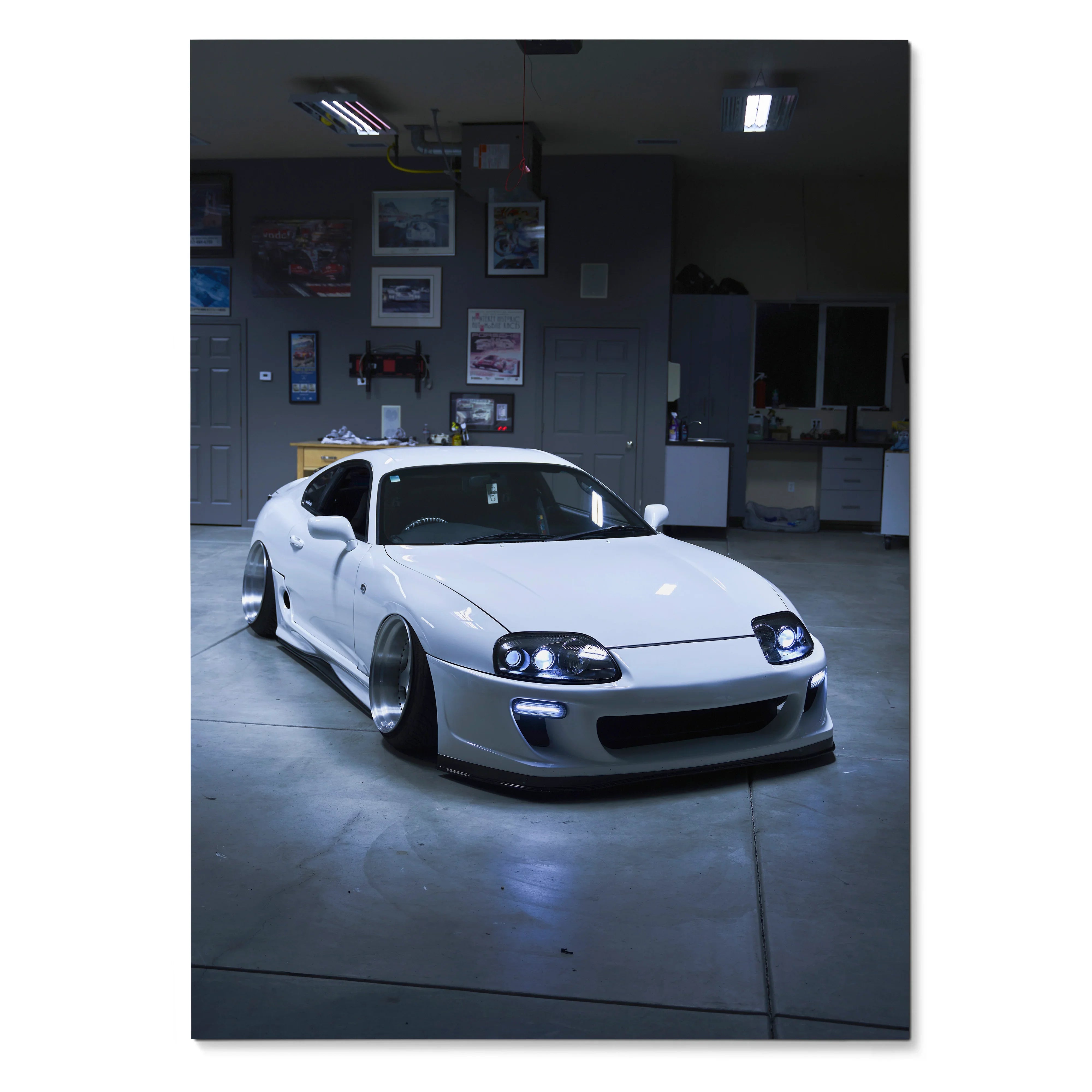 White Toyota Supra MK4 sports car in a dark garage, sharp high-resolution poster wall art.