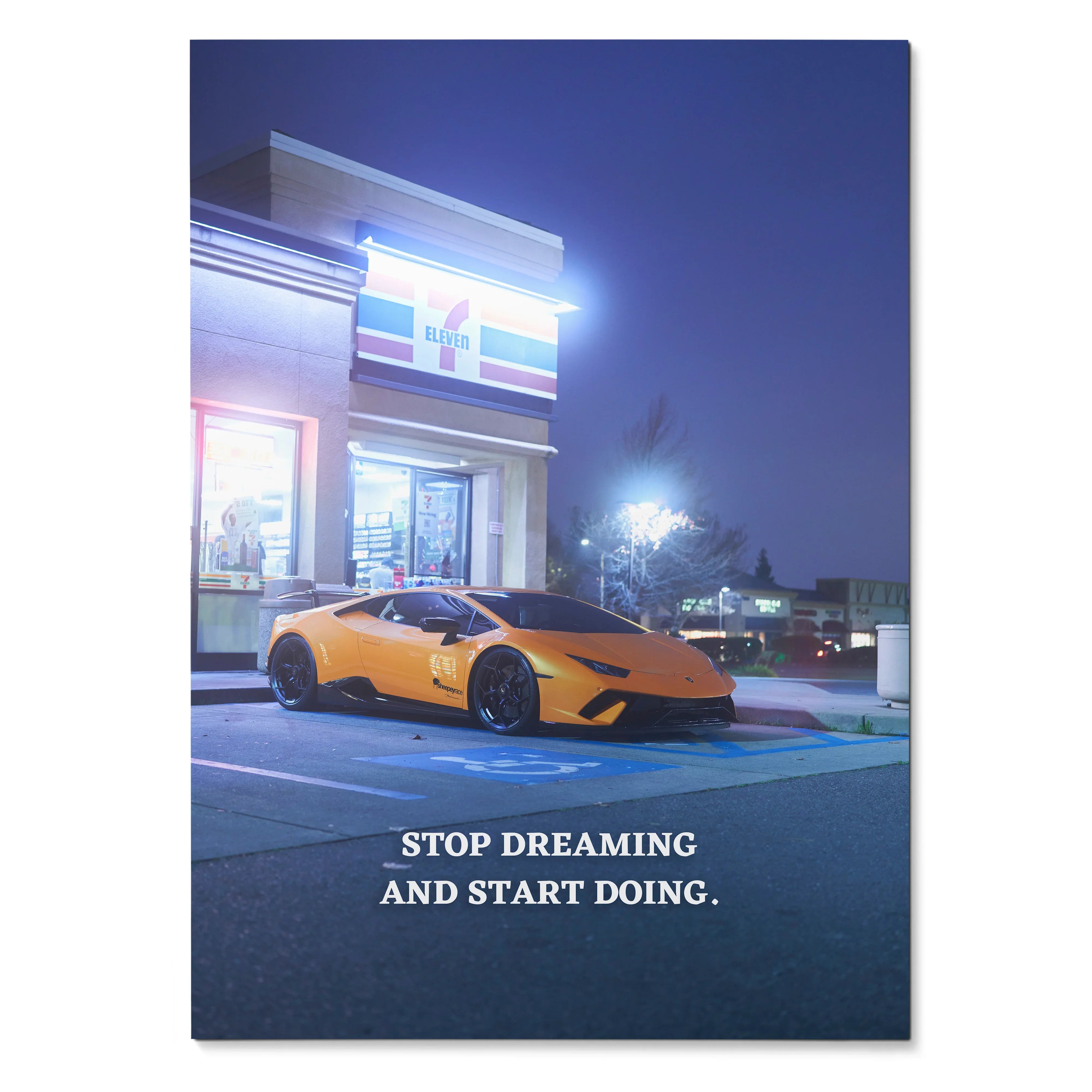 Motivational poster with yellow Lamborghini Huracan parked outside lit building at night, wall art with inspiring quote.