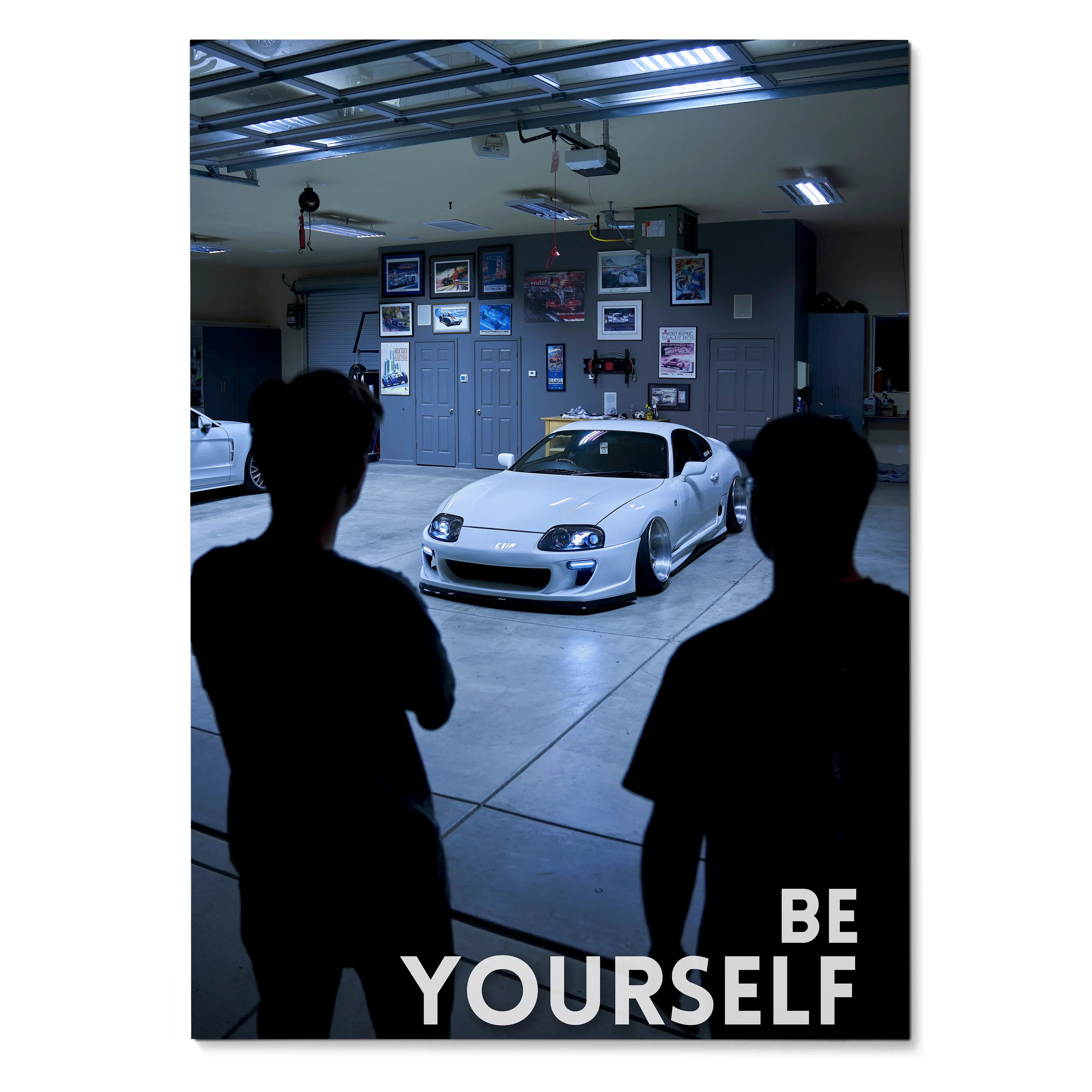 Motivational poster wall art featuring a white Toyota Supra Mk4 in a garage with "Be Yourself" text.