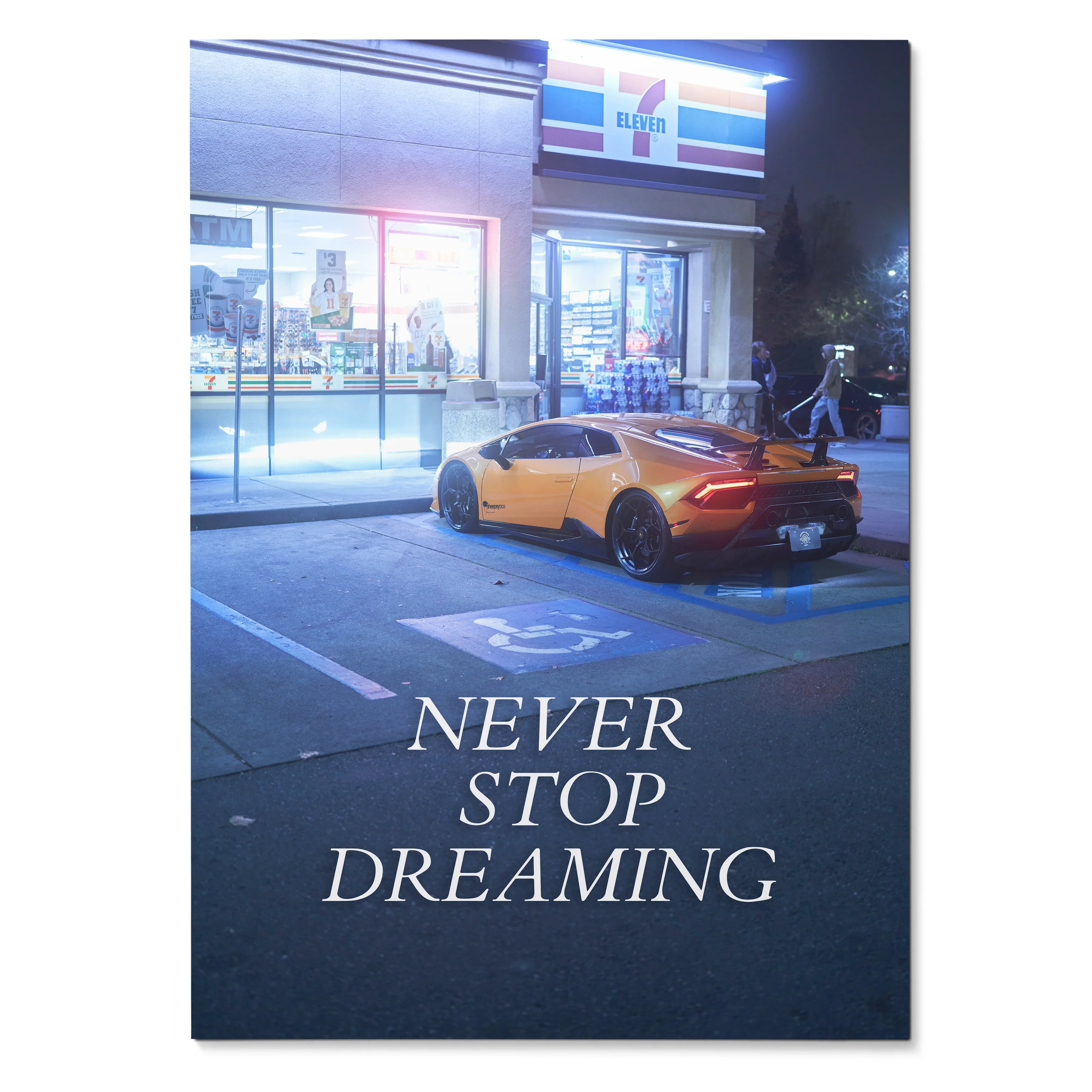 Lamborghini Huracan parked outside 7-Eleven at night with "Never Stop Dreaming" motivational poster wall art.