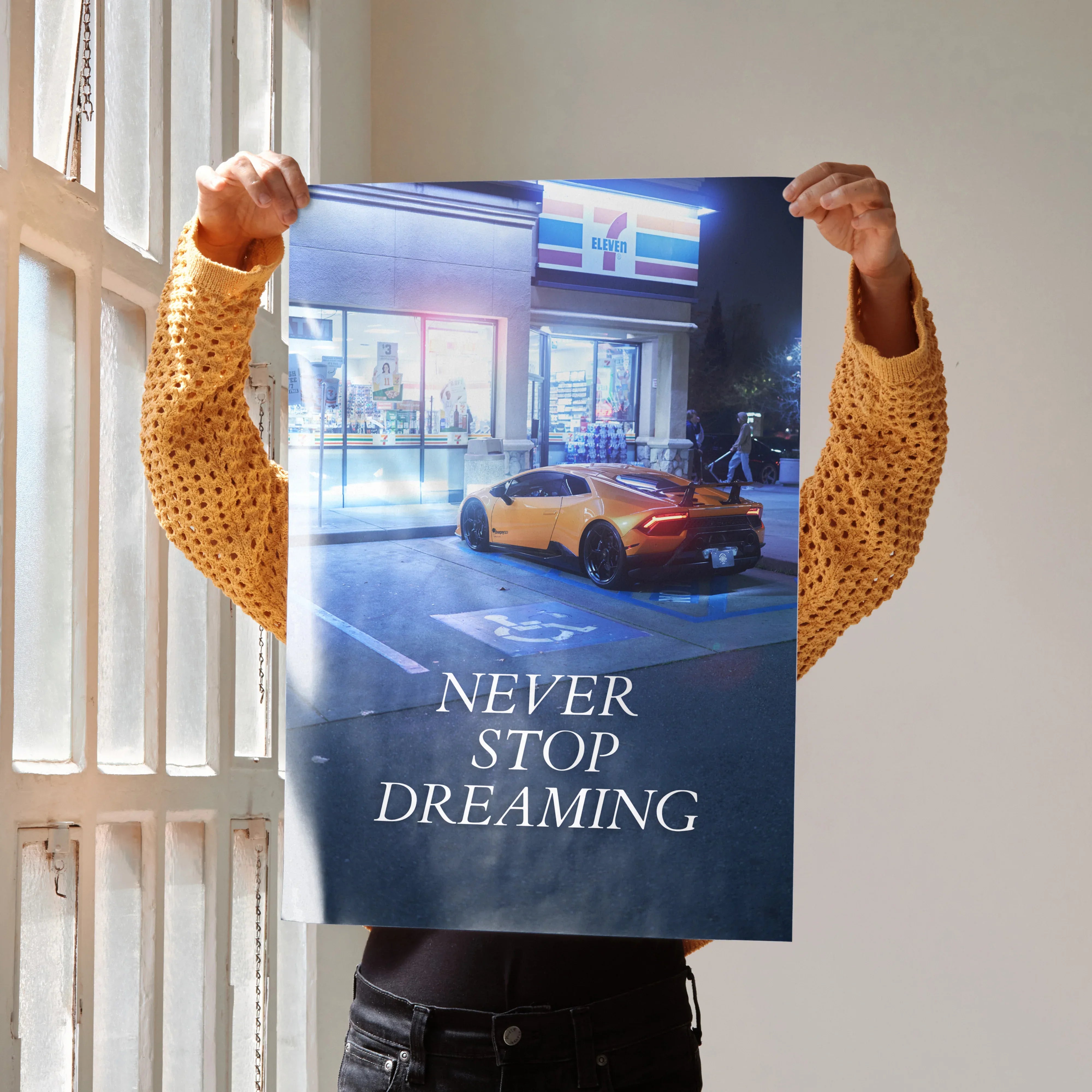 Poster wall art featuring a yellow Lamborghini Huracan with the text "Never Stop Dreaming" at night.