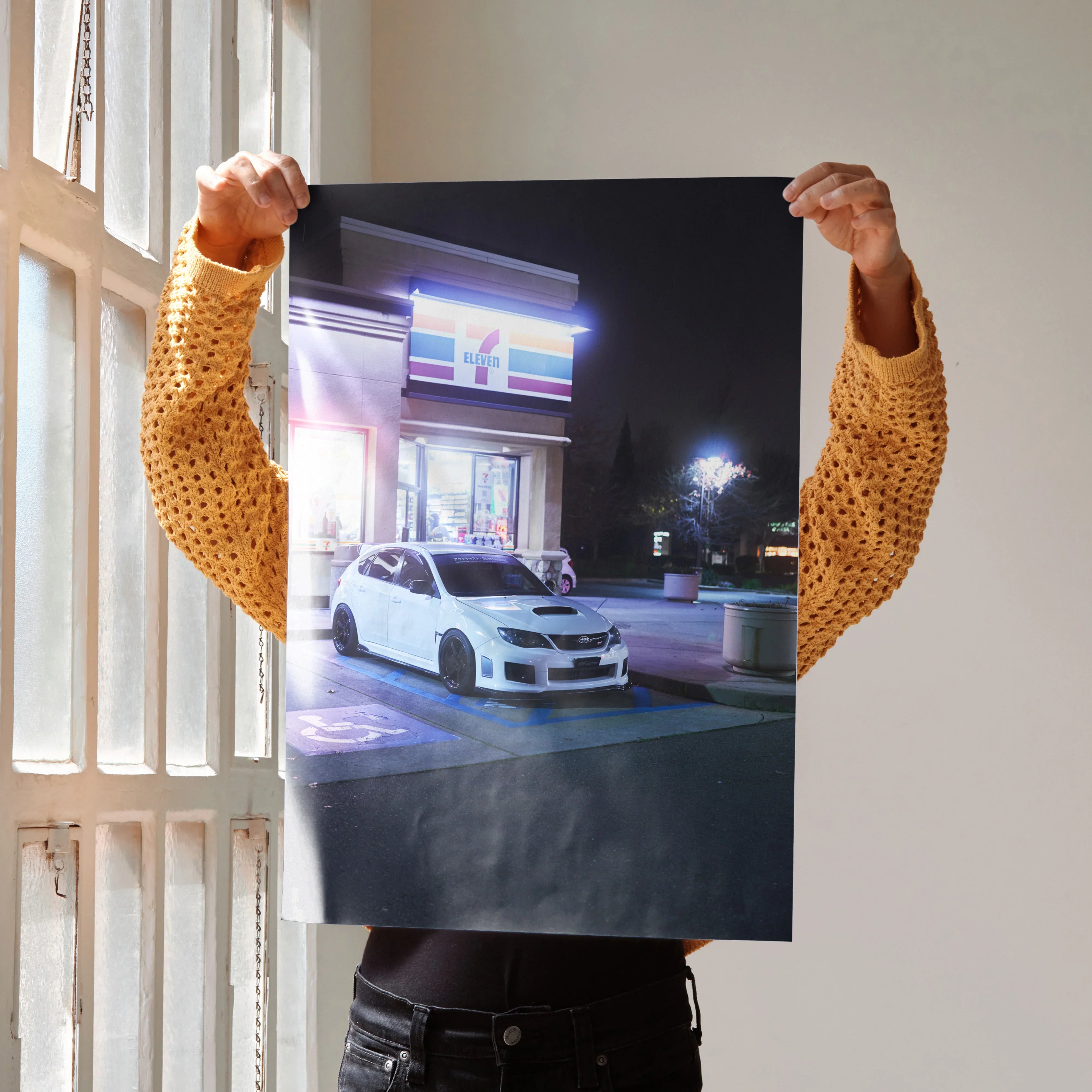 Subaru WRX STI poster wall art featuring a white car in a nighttime urban setting.