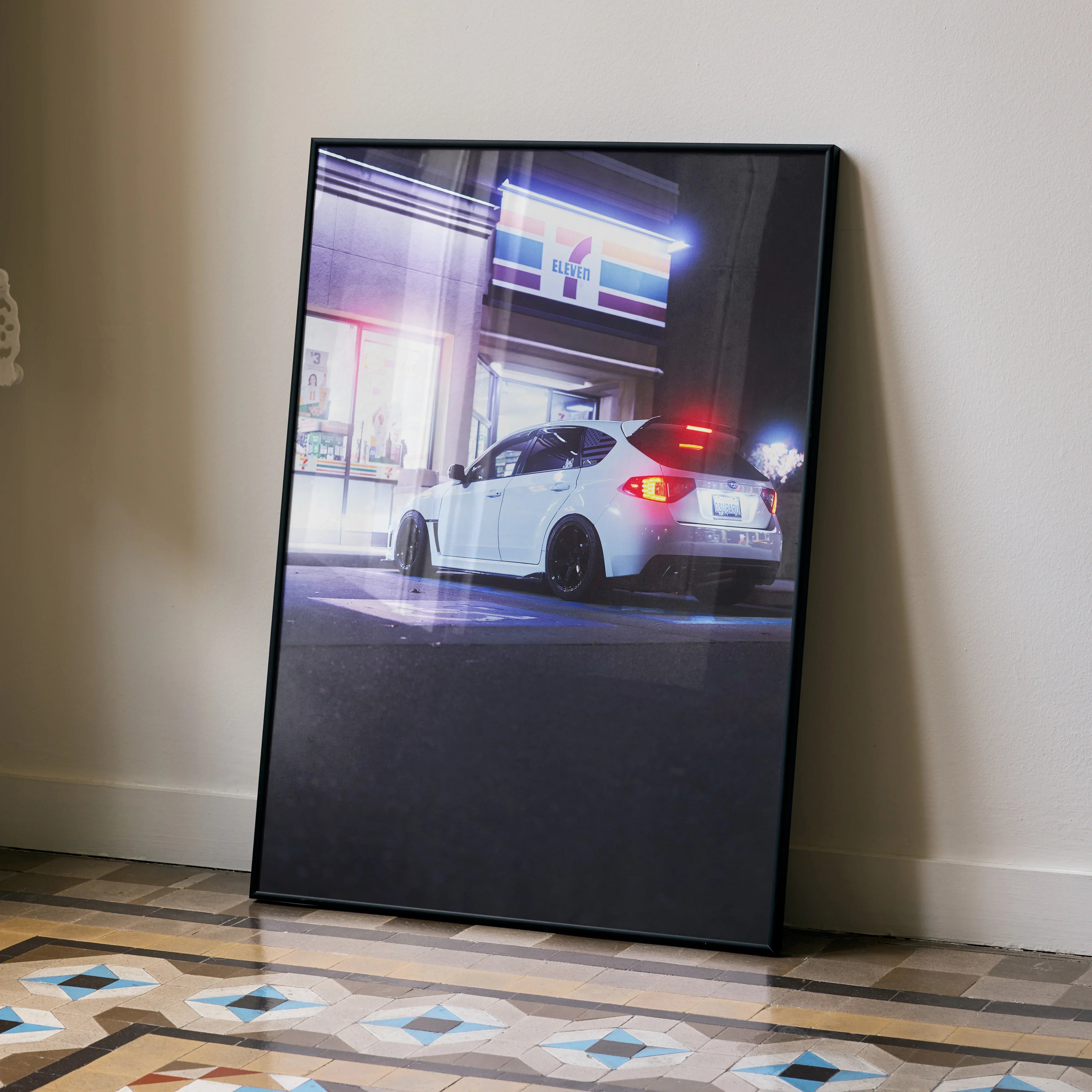 Subaru WRX STI poster showcasing a white car at night with illuminated city lights wall art.
