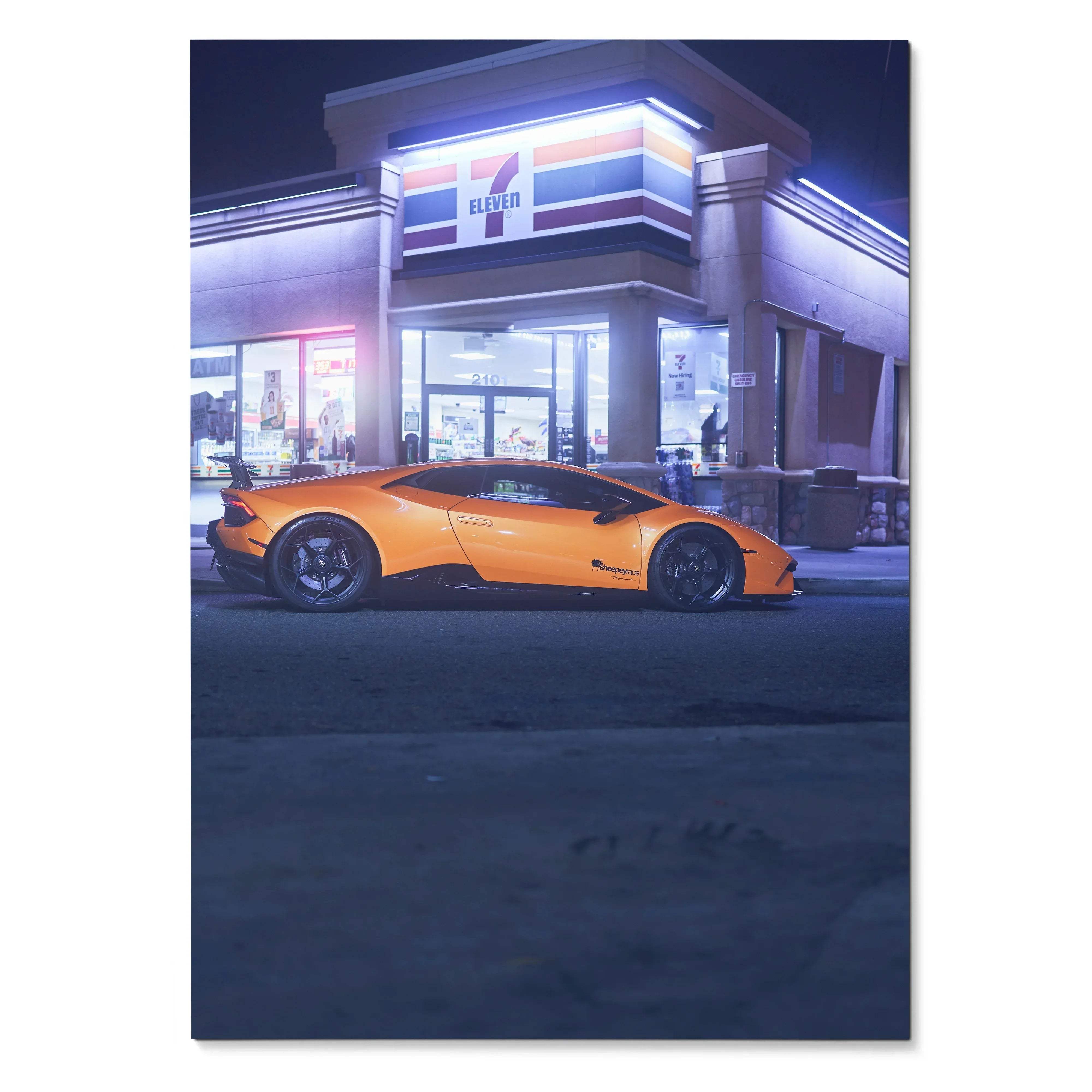 Lamborghini Huracan in bright orange parked outside illuminated 7-Eleven at night poster wall art.