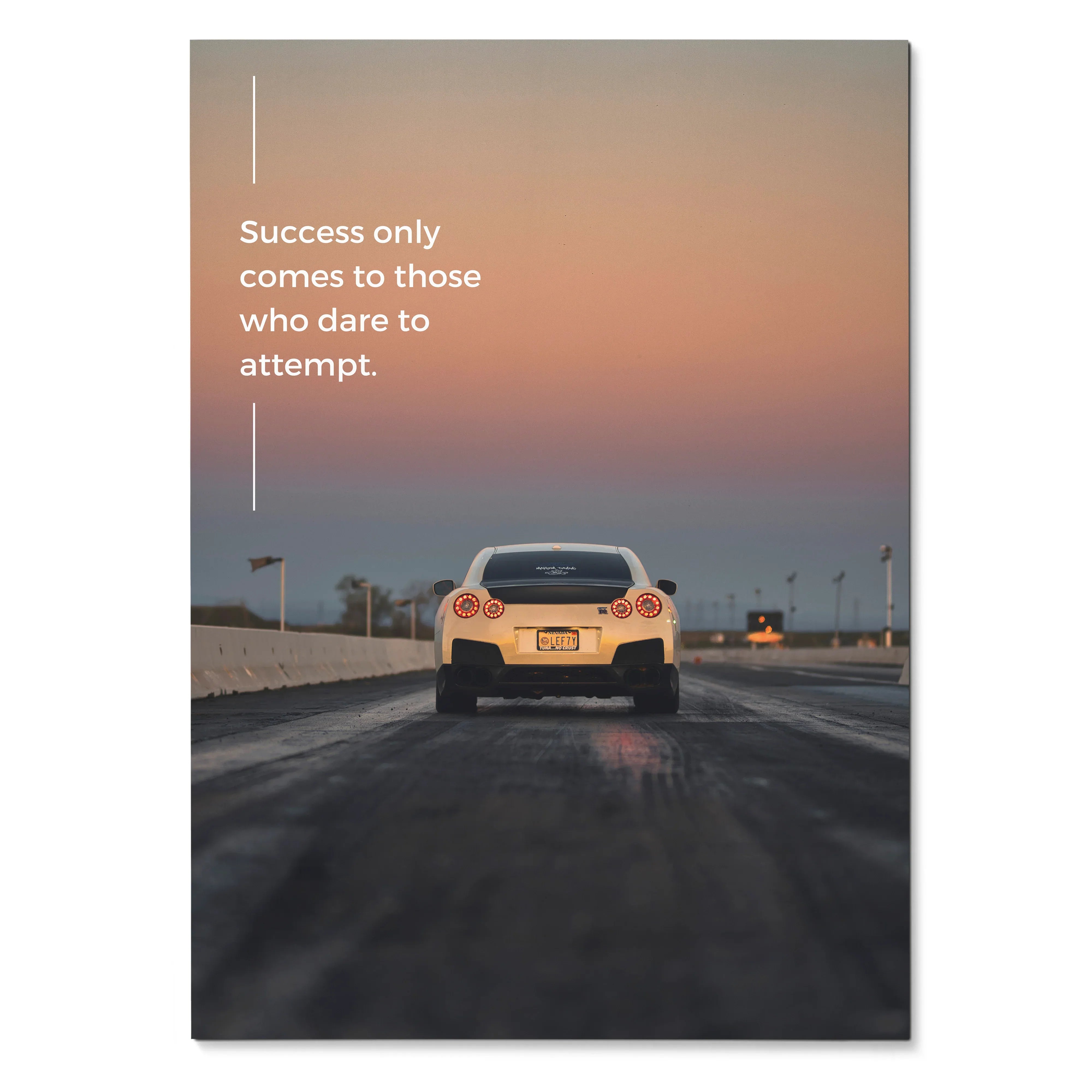 Poster wall art featuring rear view of white Nissan R35 GT-R on racetrack at sunset with motivational quote.