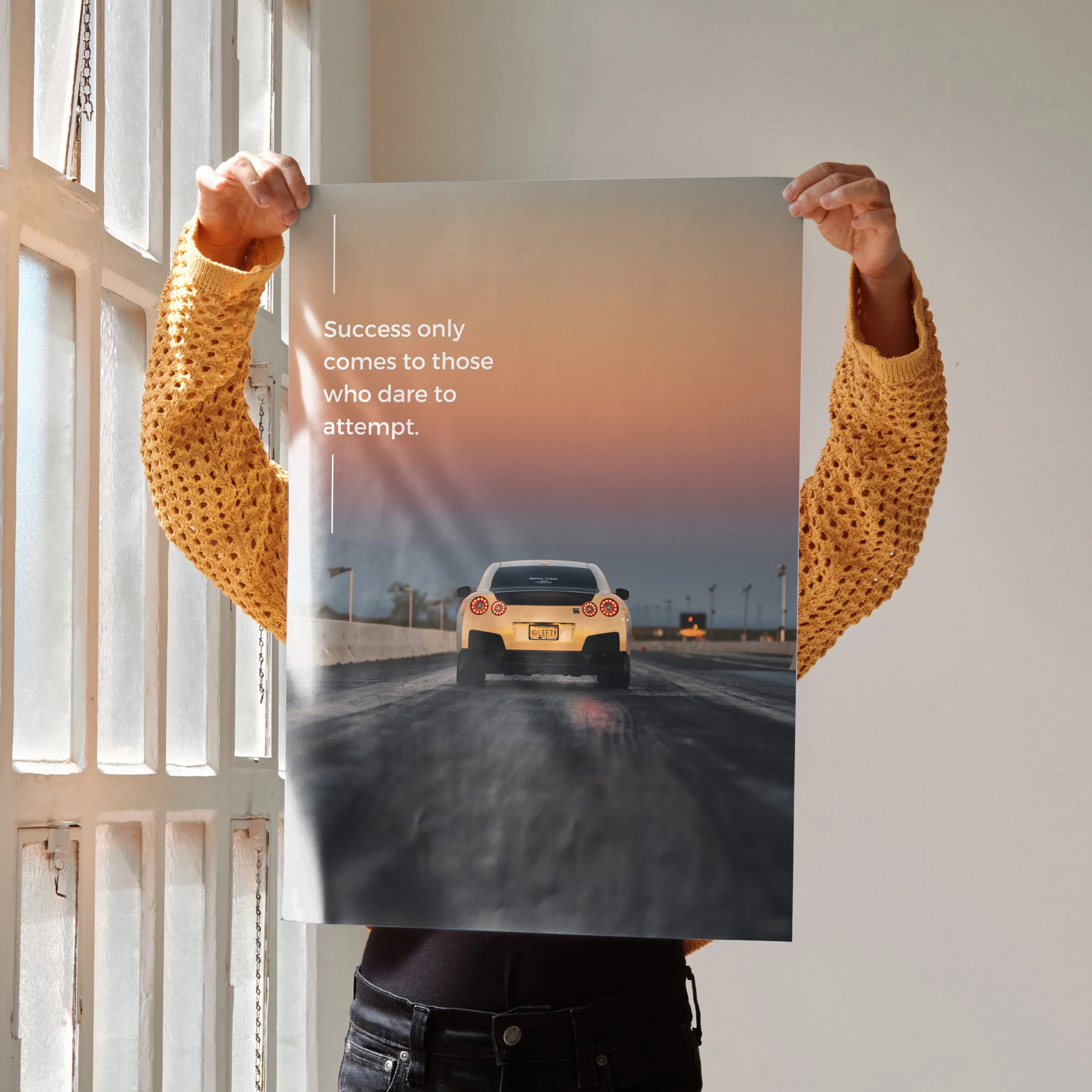 Motivational poster featuring Nissan R35 GT-R on road at sunset with inspiring text, wall art.