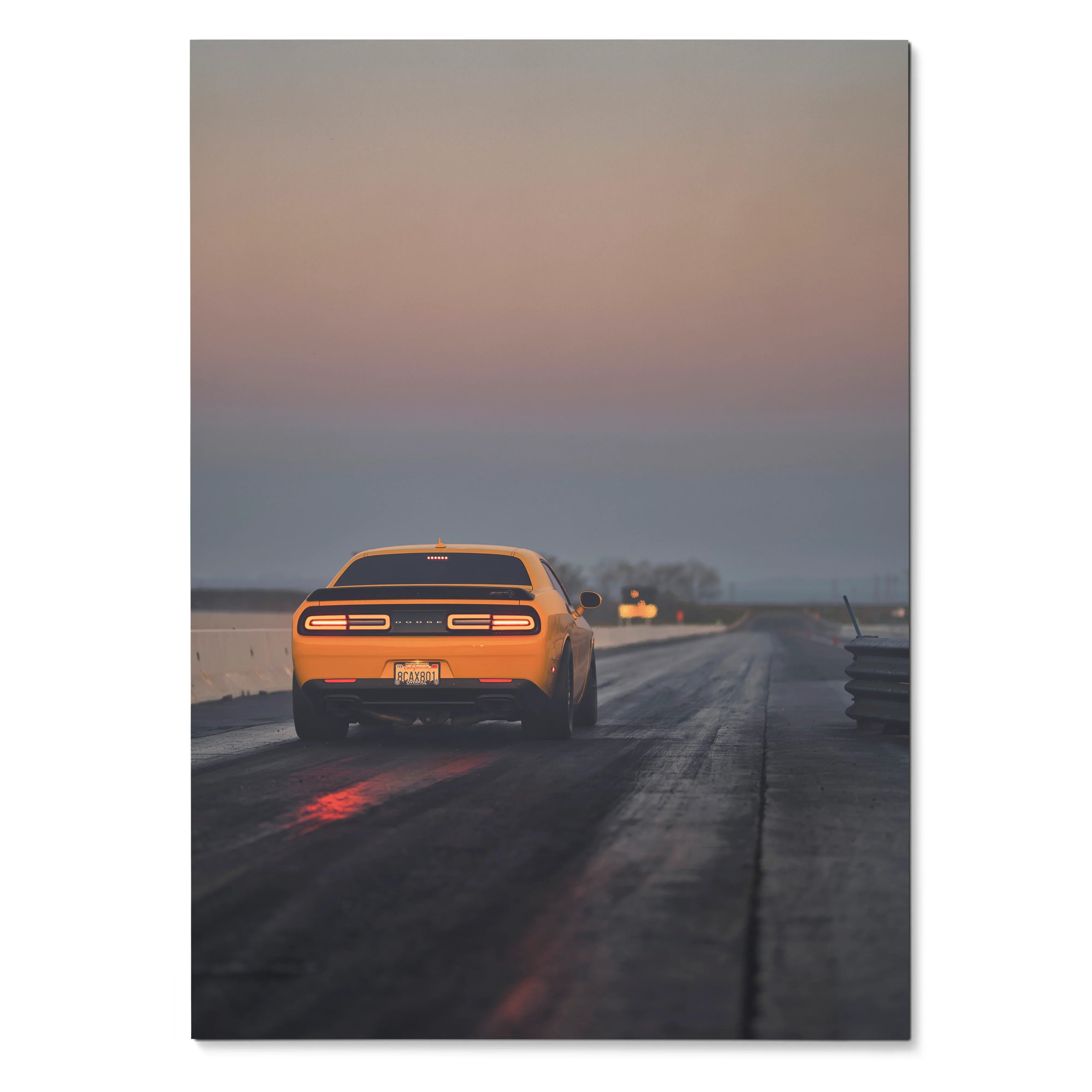 Dodge Challenger poster showing rear view on wet road at dusk, automotive wall art with moody lighting.