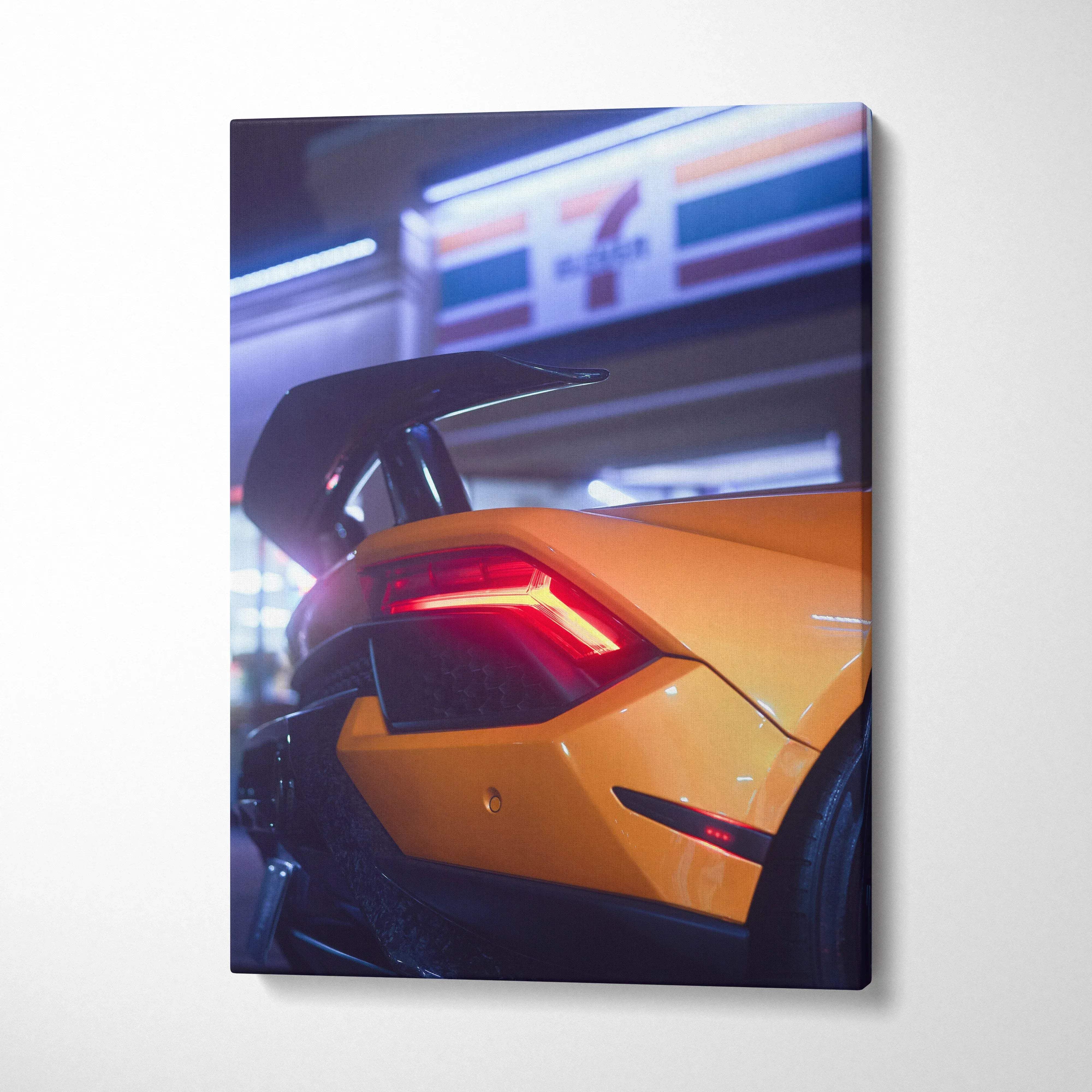 Yellow Lamborghini Huracan rear close-up with illuminated taillight on vertical canvas wall art.