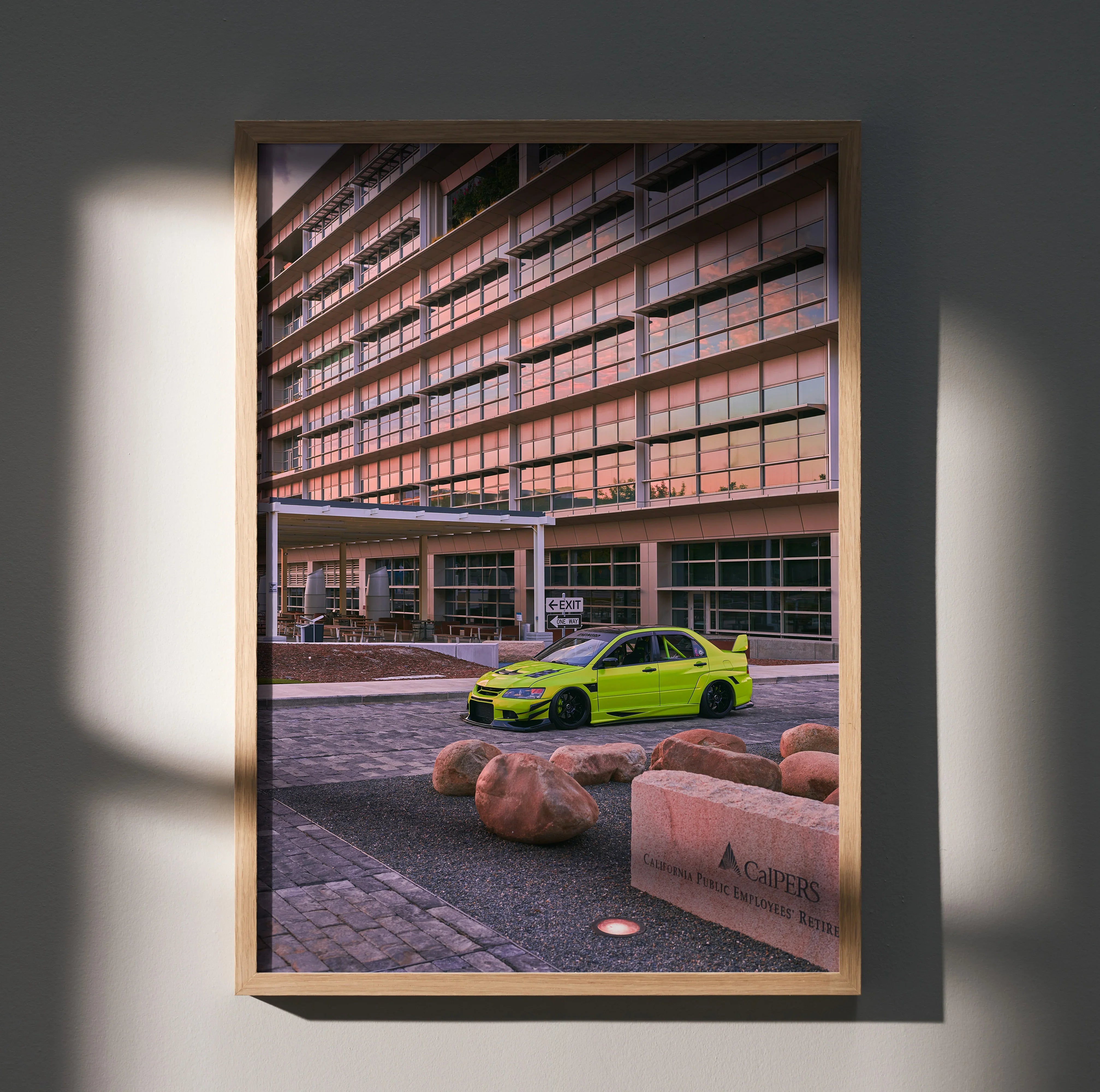 Mitsubishi Evo 9 parked in urban setting vibrant poster wall art with warm sunset reflection.