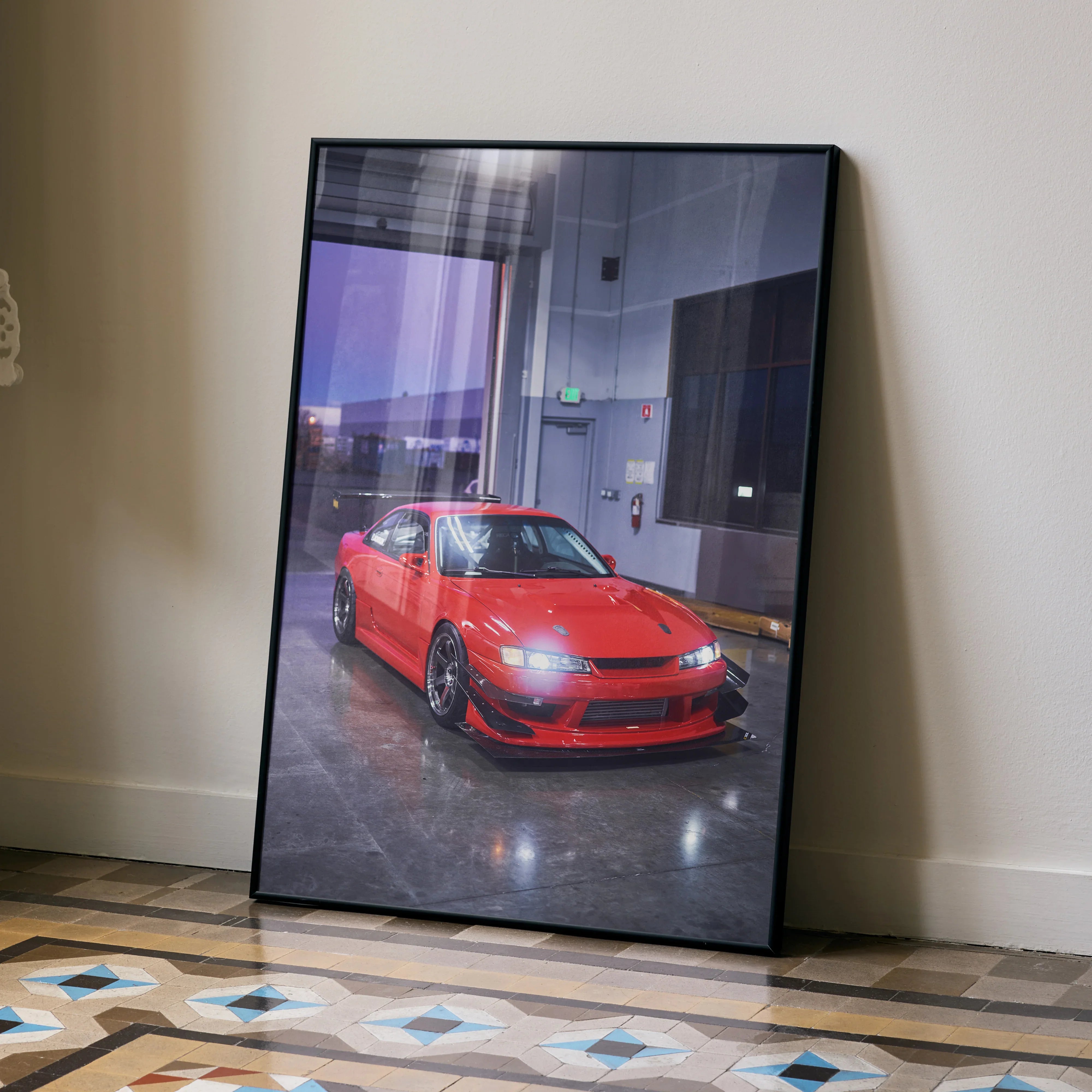 Red Nissan 240sx S14 Kouki car poster leaning against wall, automotive wall art decor.