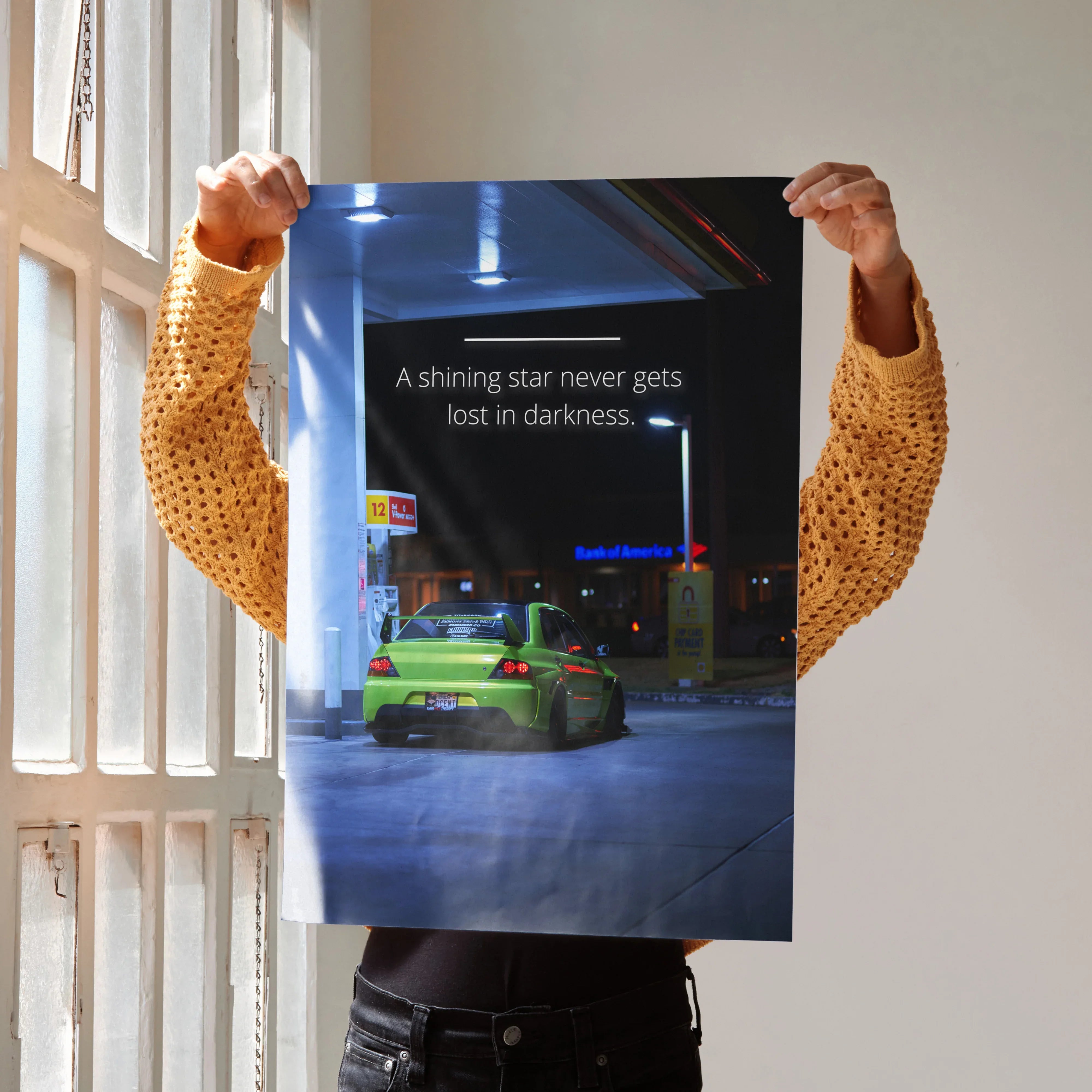 Motivational poster wall art featuring a green Mitsubishi Evo 9 with inspiring text on a nighttime street backdrop.