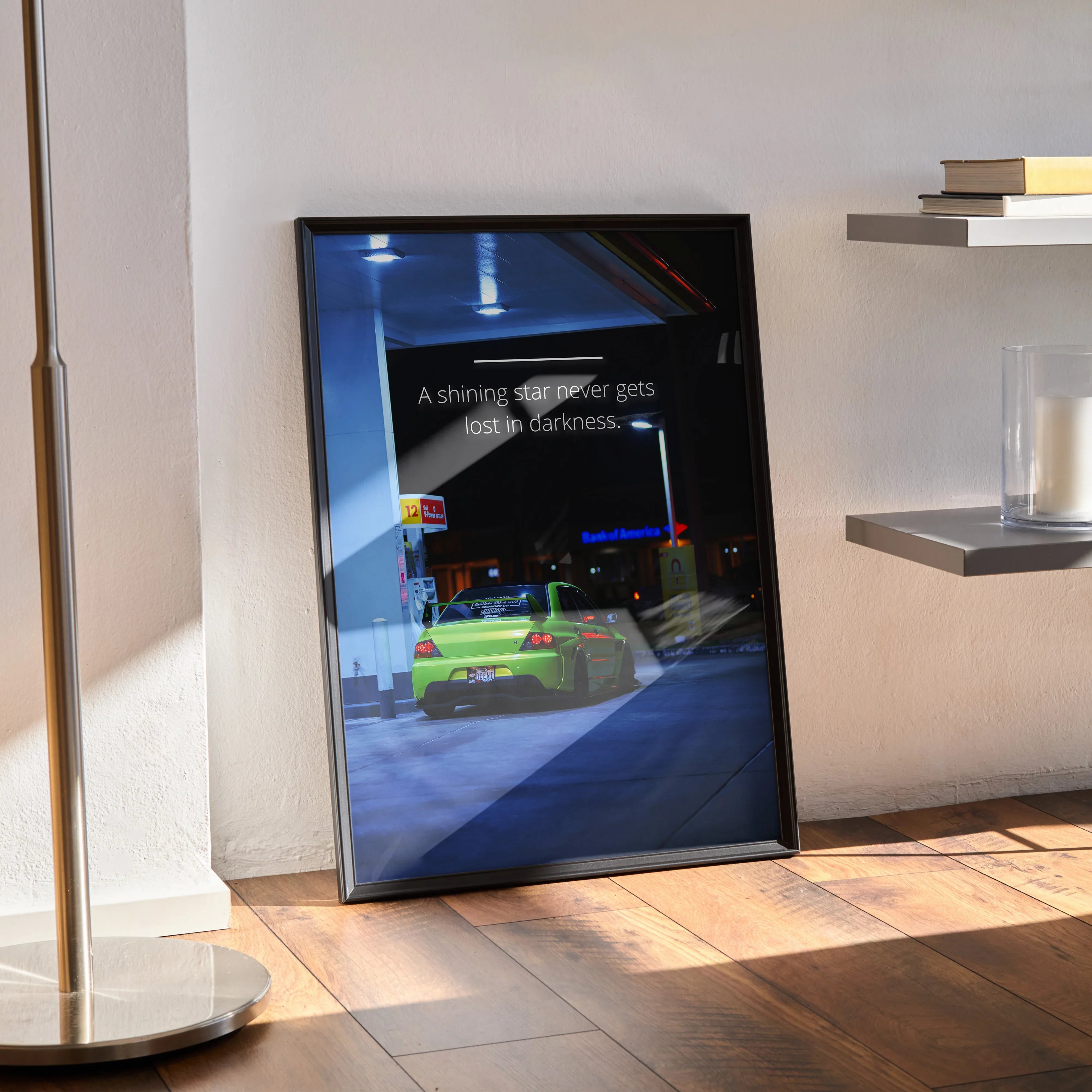 Motivational Mitsubishi Evo 9 poster wall art with inspiring text in black frame leaning on floor.