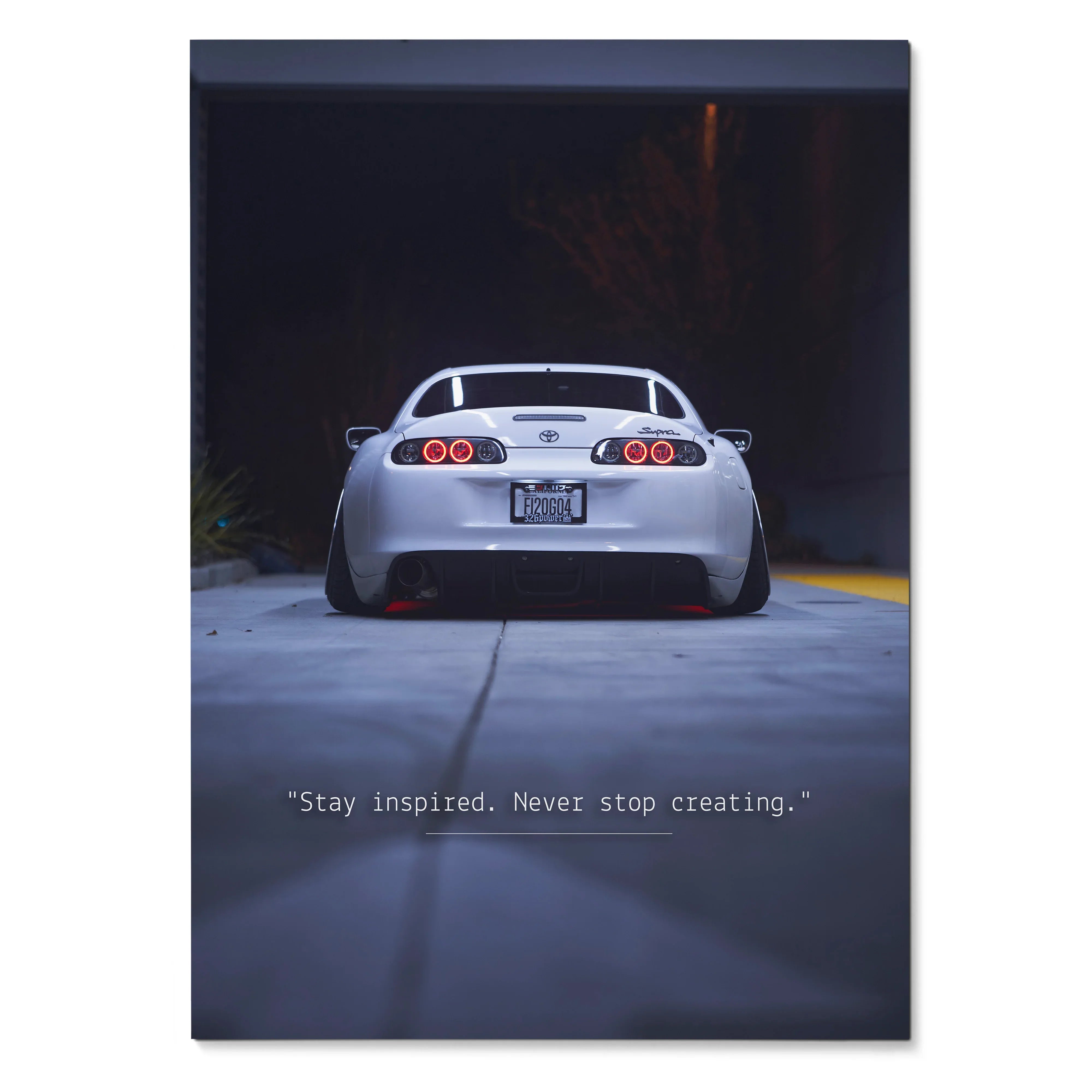Toyota Supra Mk4 rear view at night with inspirational quote poster wall art.