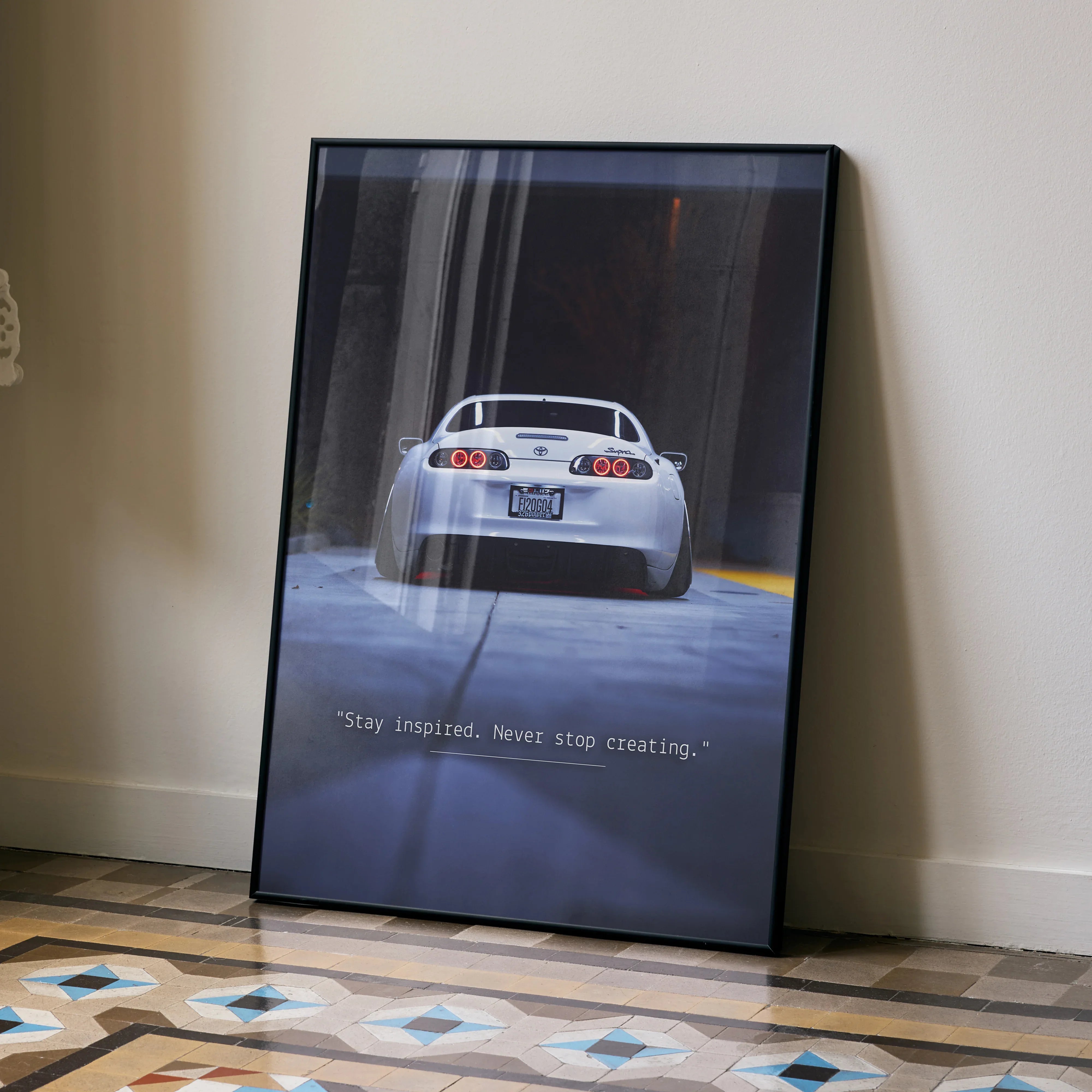Toyota Supra Mk4 motivational poster with inspiring text, sleek sports car rear view wall art.