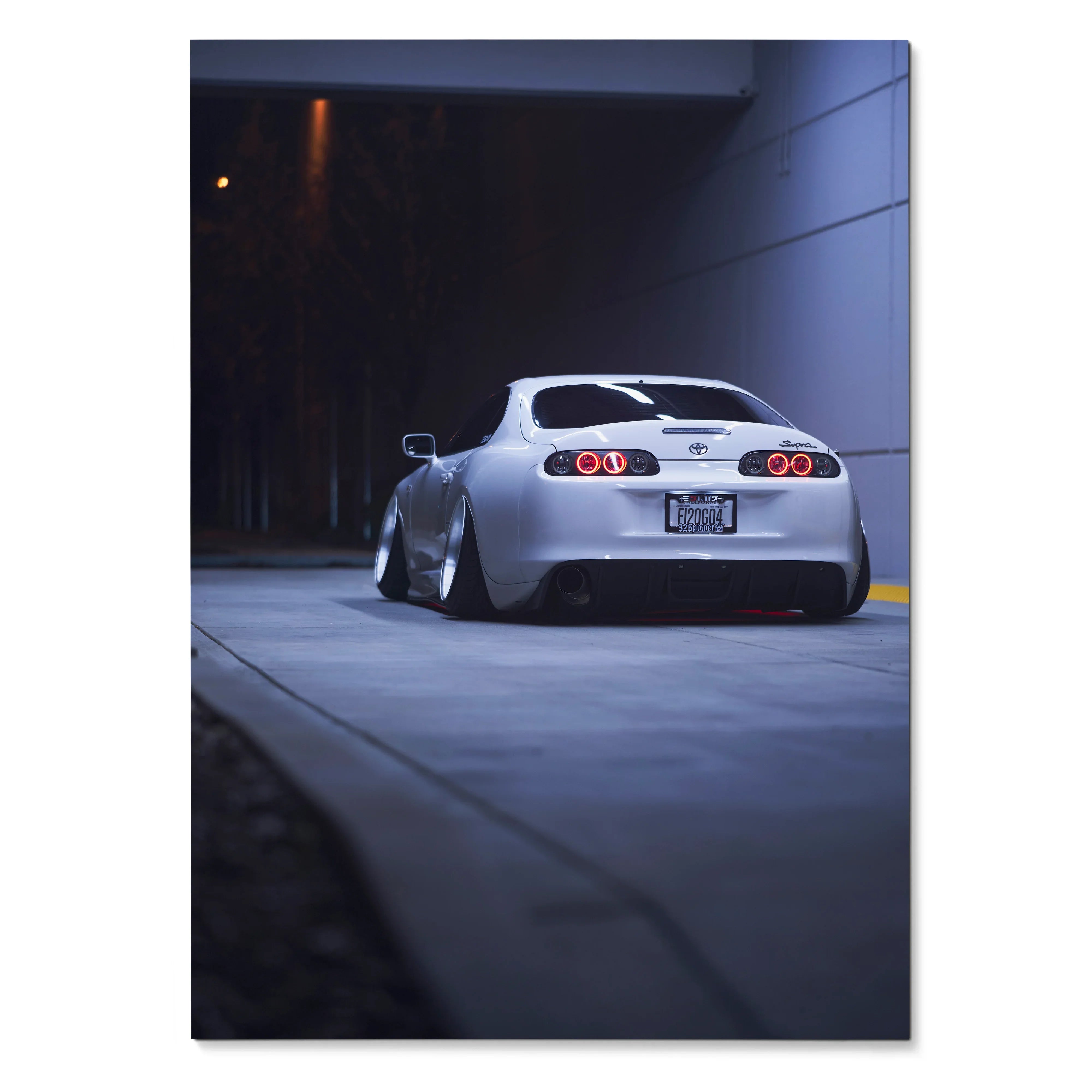 Toyota Supra MK4 rear view in urban night setting poster, sleek white sports car wall art.