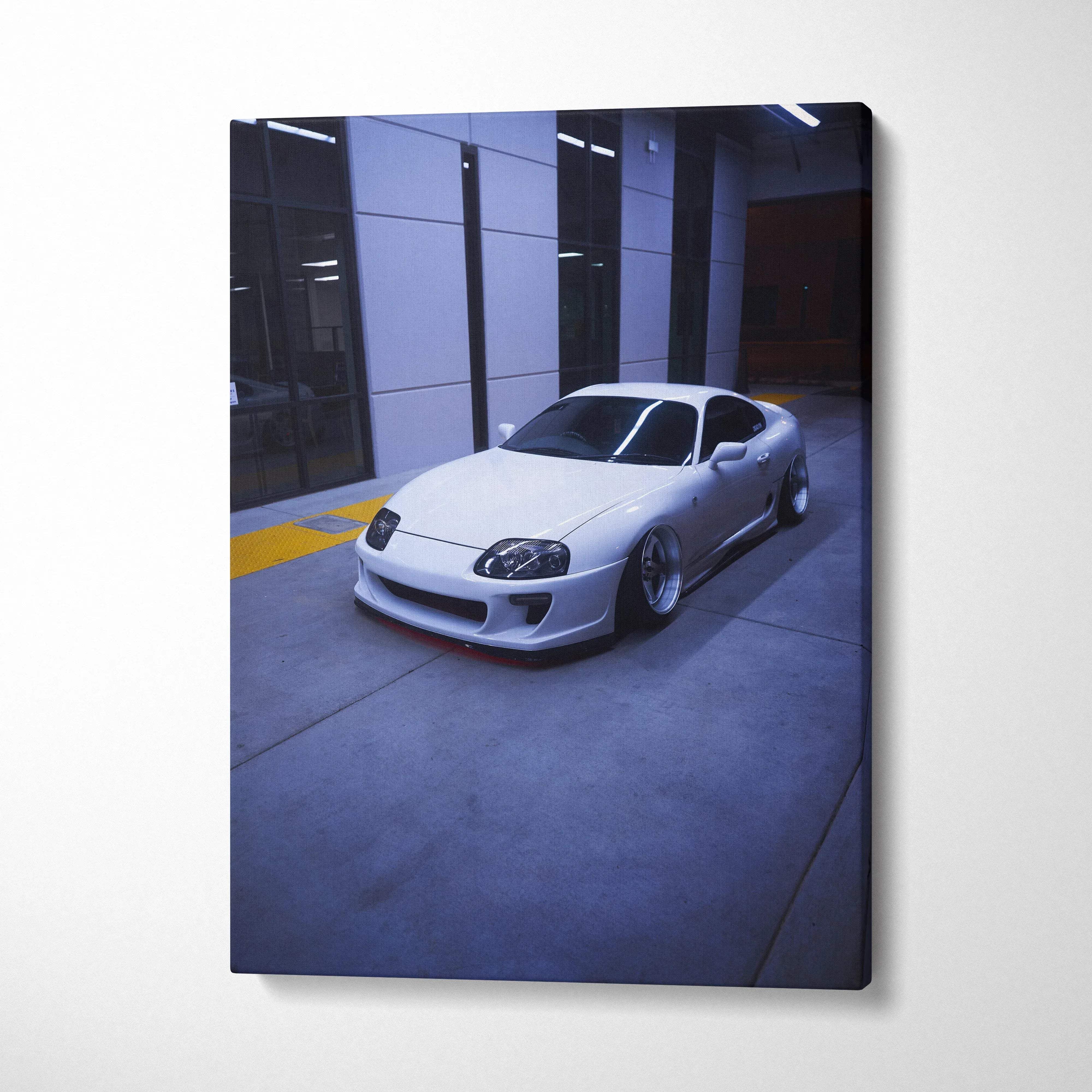 Toyota Supra MK4 sleek silver sports car canvas art wall decor in modern garage setting.