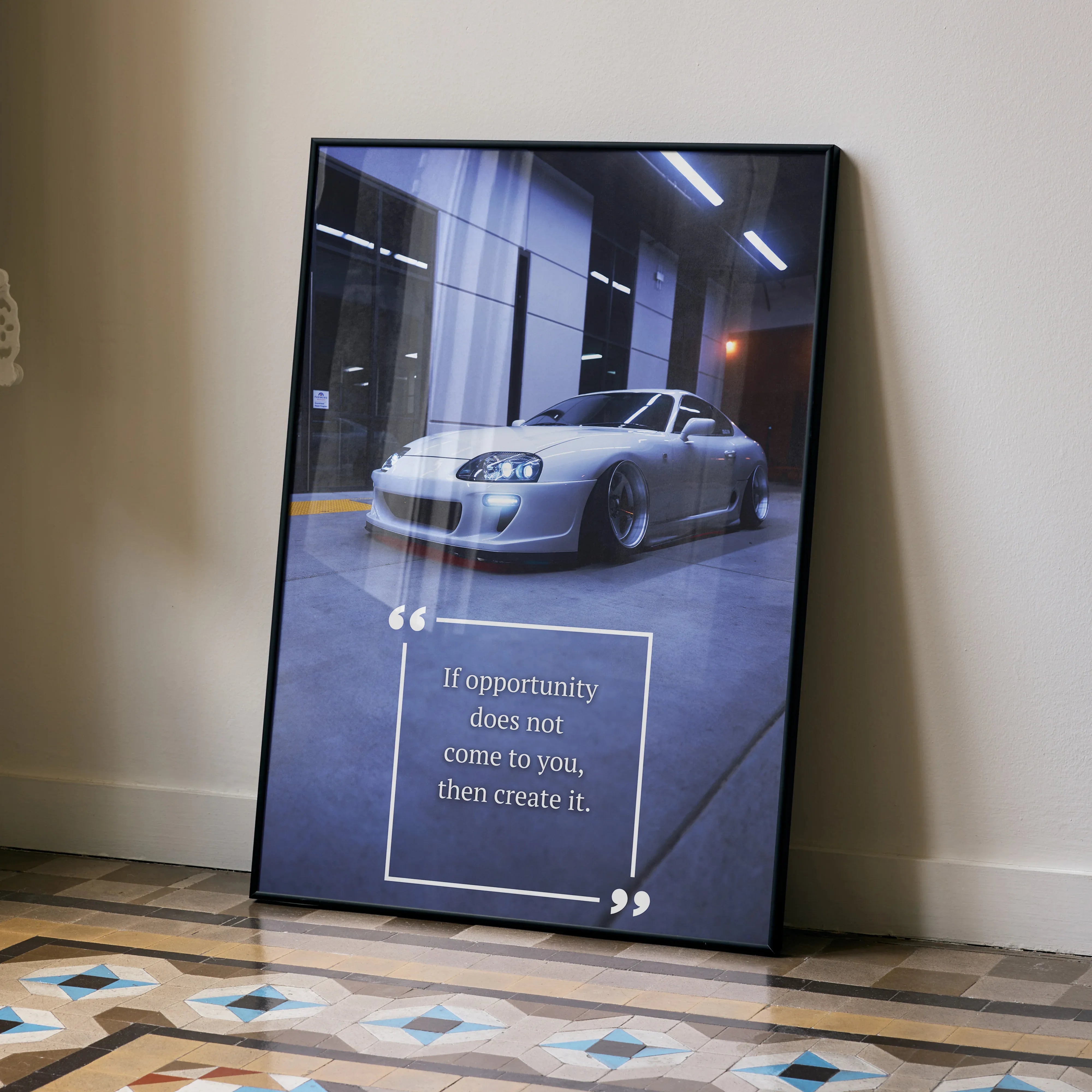 Toyota Supra Mk4 poster wall art with motivational quote in modern garage setting.