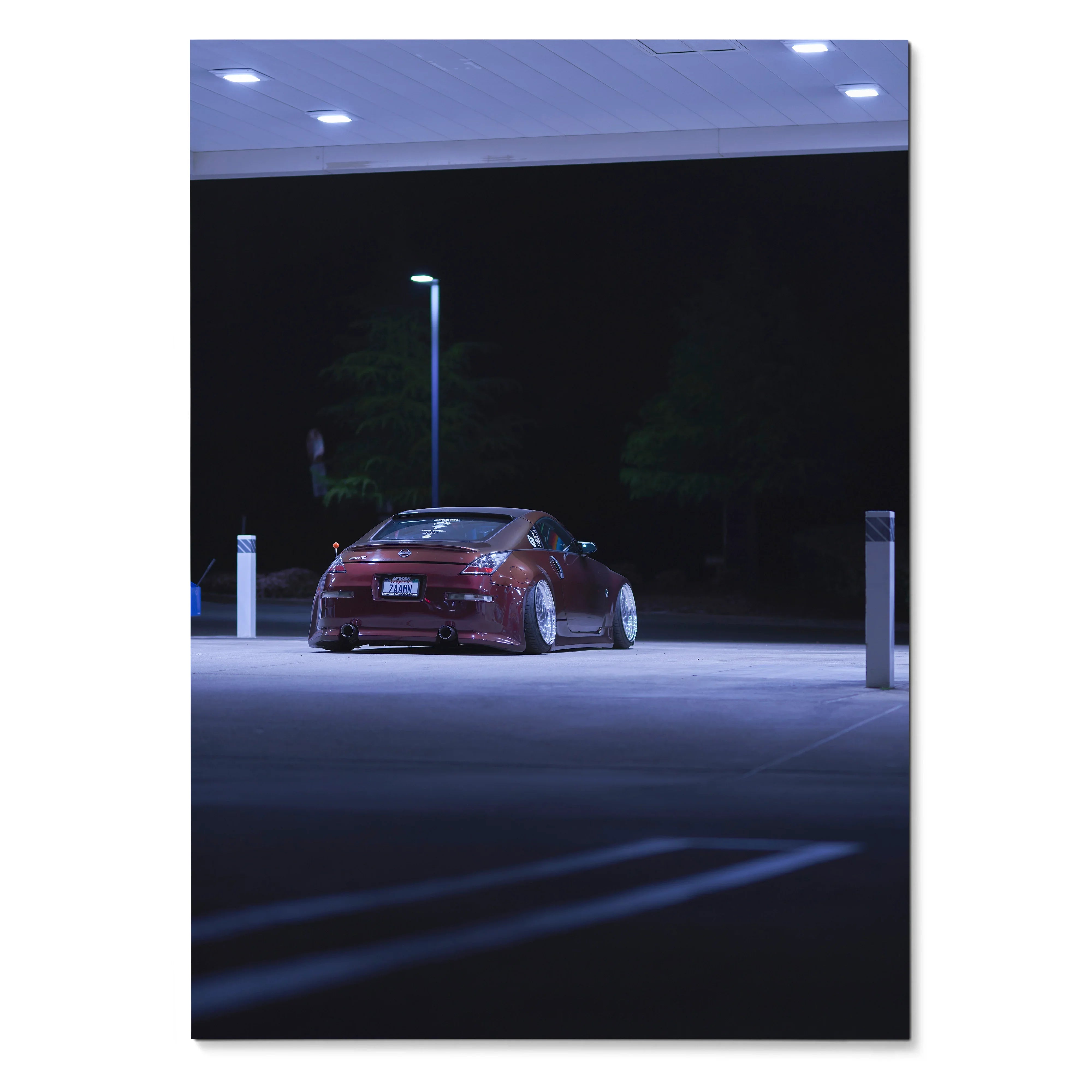 Nissan 350Z in dark red under streetlight at night, high-resolution poster wall art.