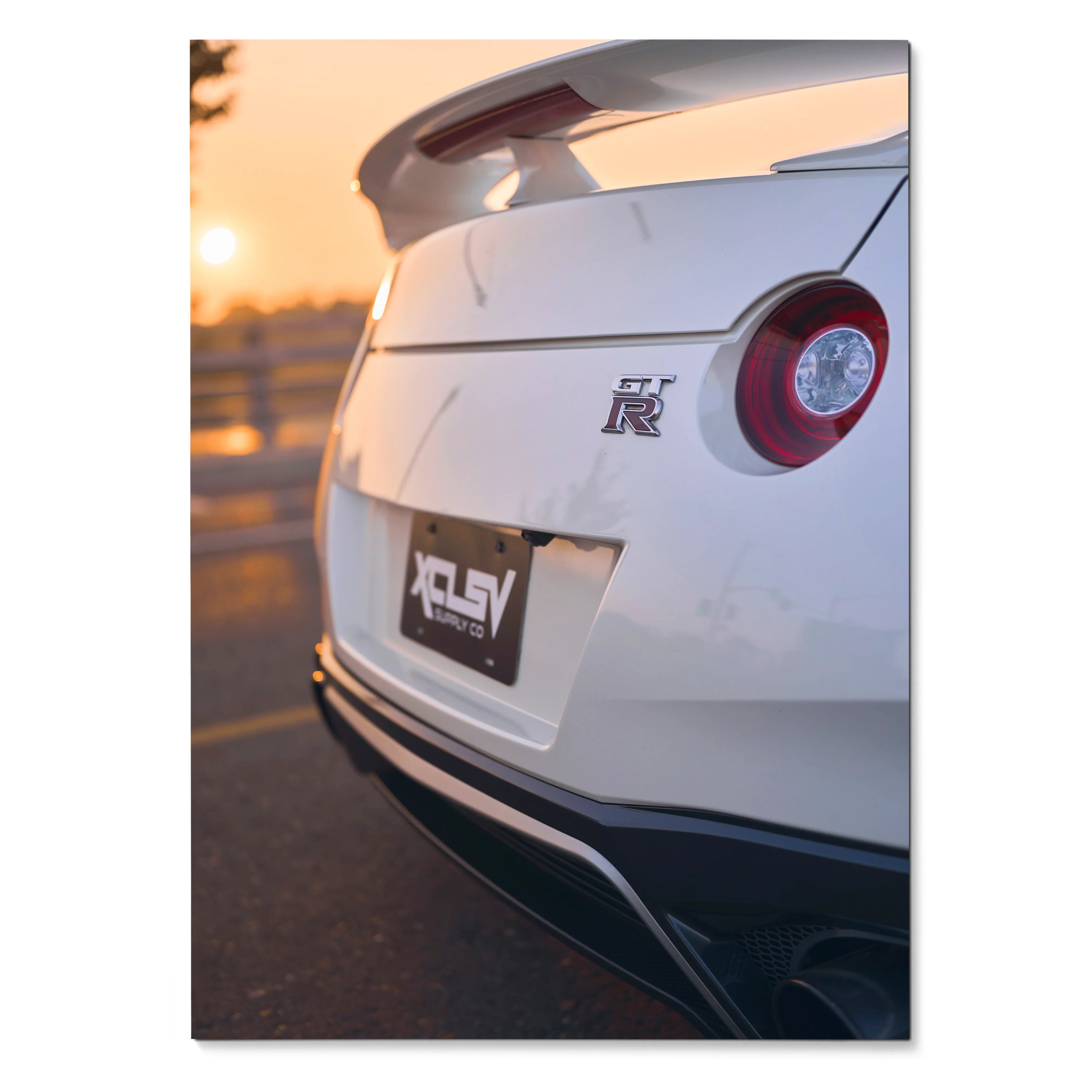 Nissan R35 GTR rear close-up poster with sunset glow, high-resolution wall art decor.