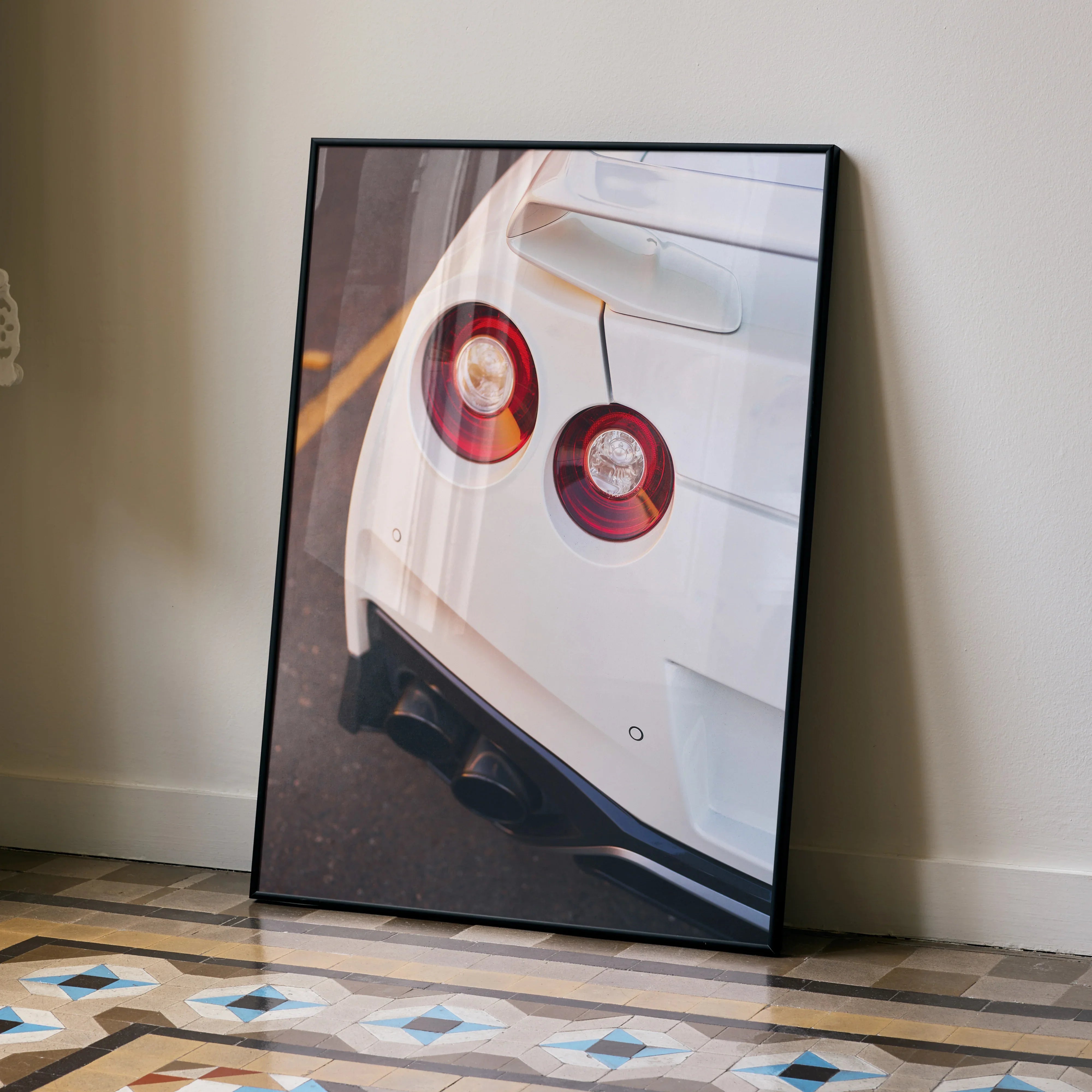 Nissan GTR R35 rear taillights close-up poster wall art with white car and black frame.