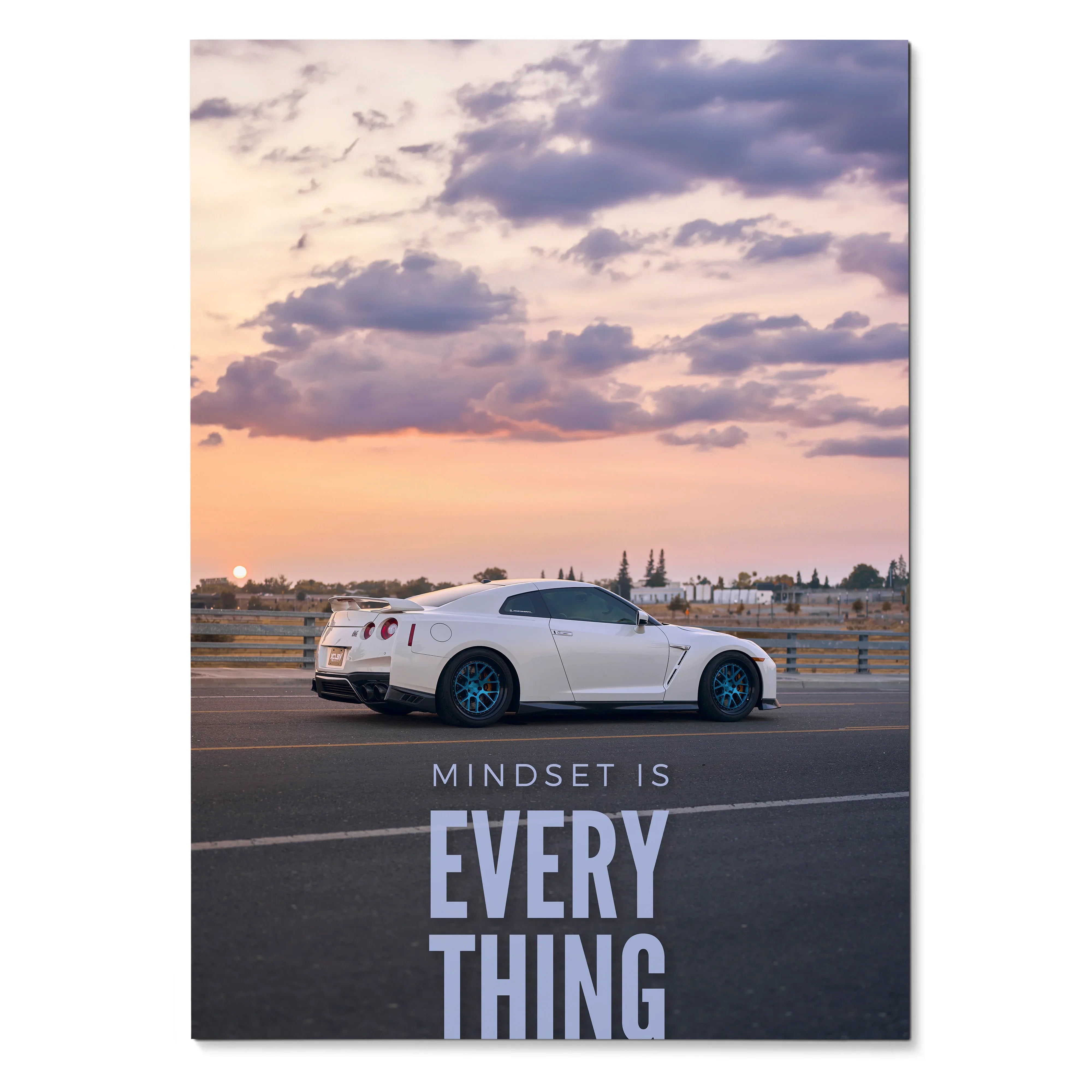 Poster wall art featuring a white Nissan R35 GT-R on a sunset road with inspirational text "Mindset is Everything".