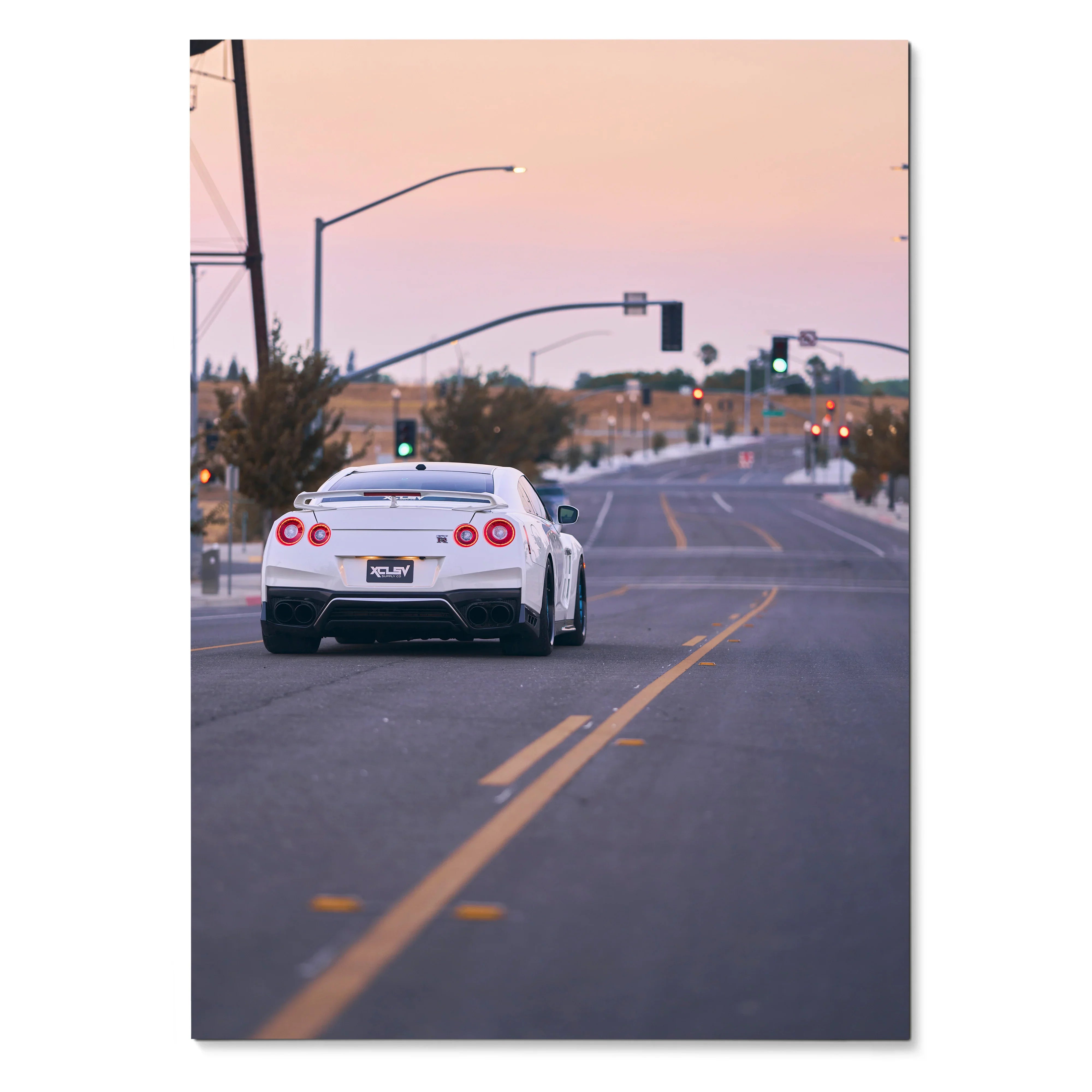 Nissan GTR R35 rear view on road at sunset poster wall art.